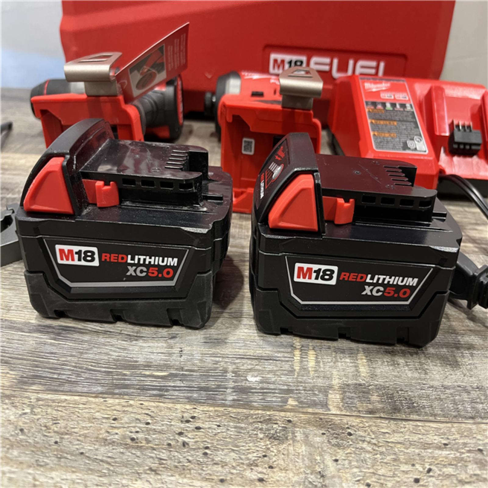 AS-IS Milwaukee FUEL 18V Lithium-Ion Brushless Cordless Hammer Drill and Impact Driver Combo Kit