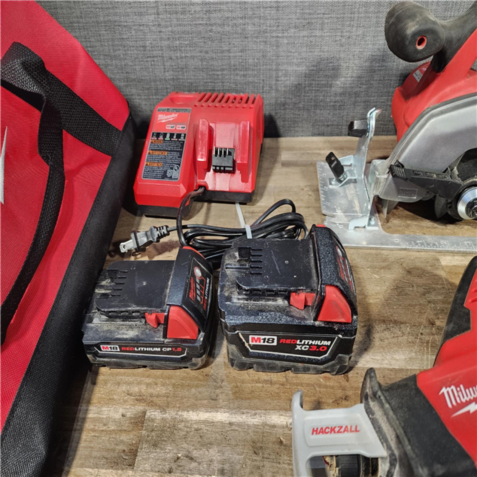 HOUSTON LOCATION - AS-IS Milwaukee M18 18-Volt Lithium-Ion Cordless Combo Tool Kit (5-Tool) with (1) 3.0Ah and (1) 1.5Ah Battery  (1) Charger  (1) Tool Bag