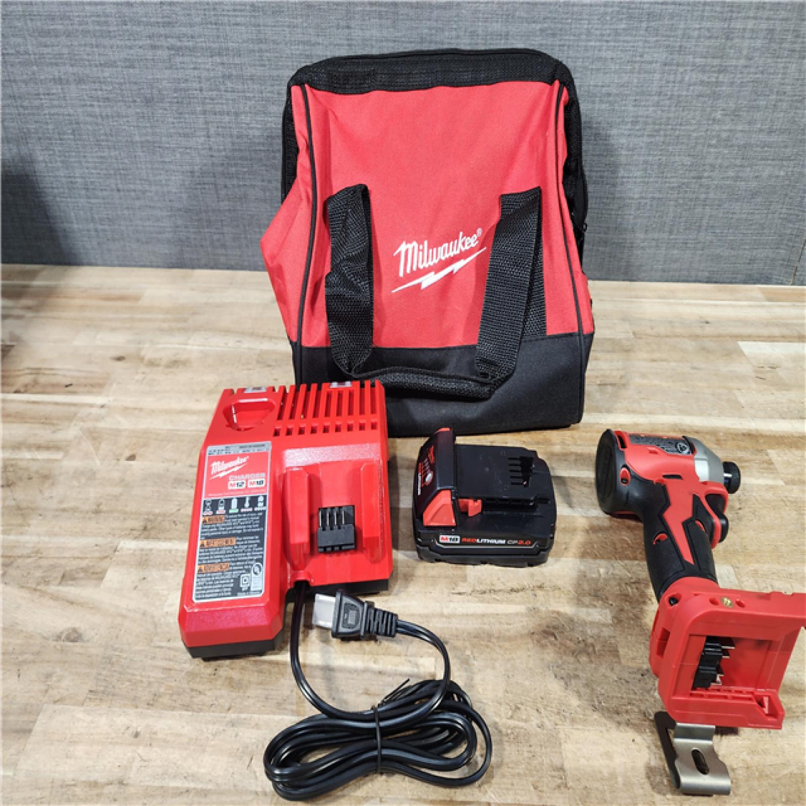 HOUSTON LOCATION - AS - IS Milwaukee 18-Volt Lithium-Ion Compact Brushless Cordless 1/4 in. Impact Driver Kit