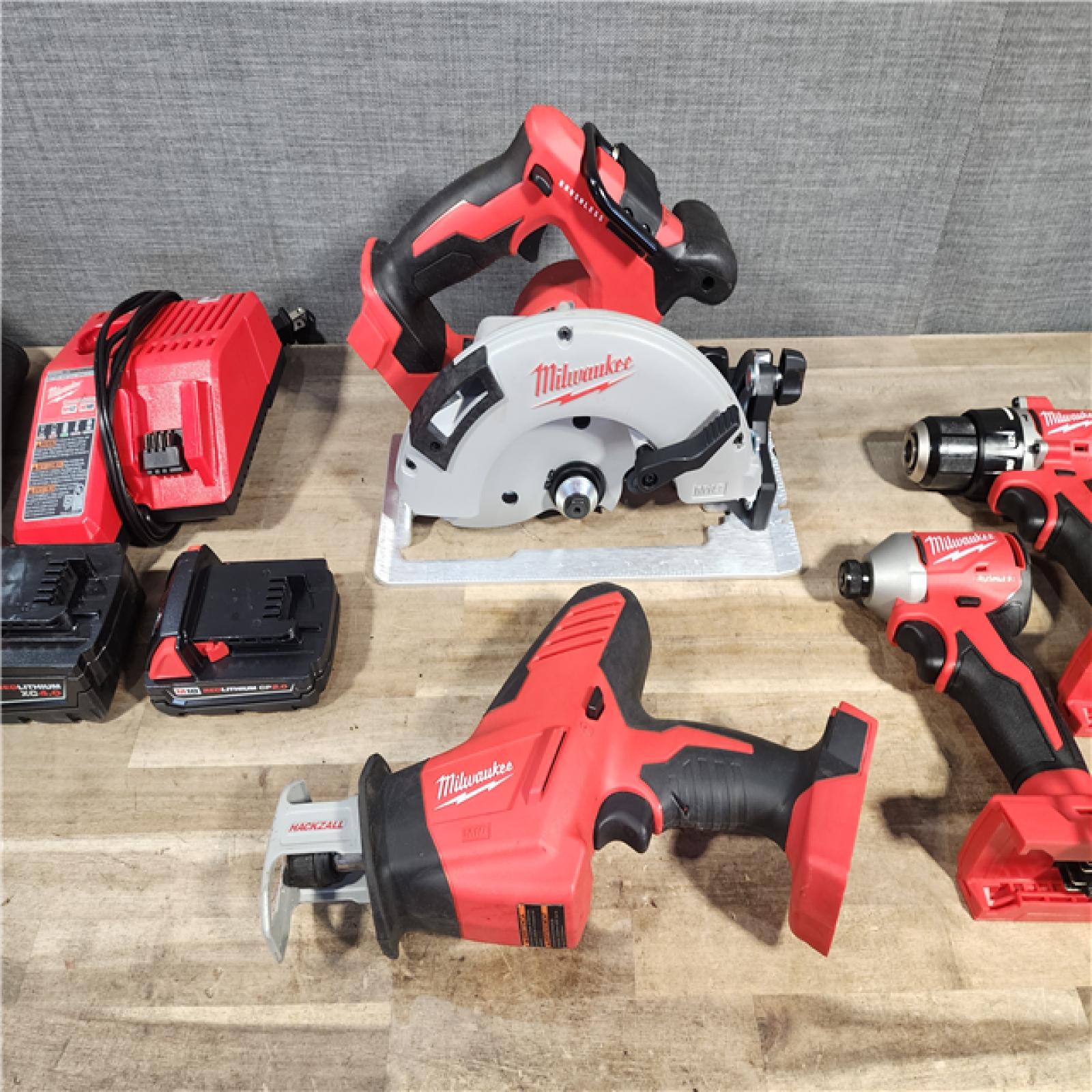 HOUSTON LOCATION - AS-IS MILWAUKEE 4 TOOL COMBO KIT W/ (2) BATTERY & CHARGER