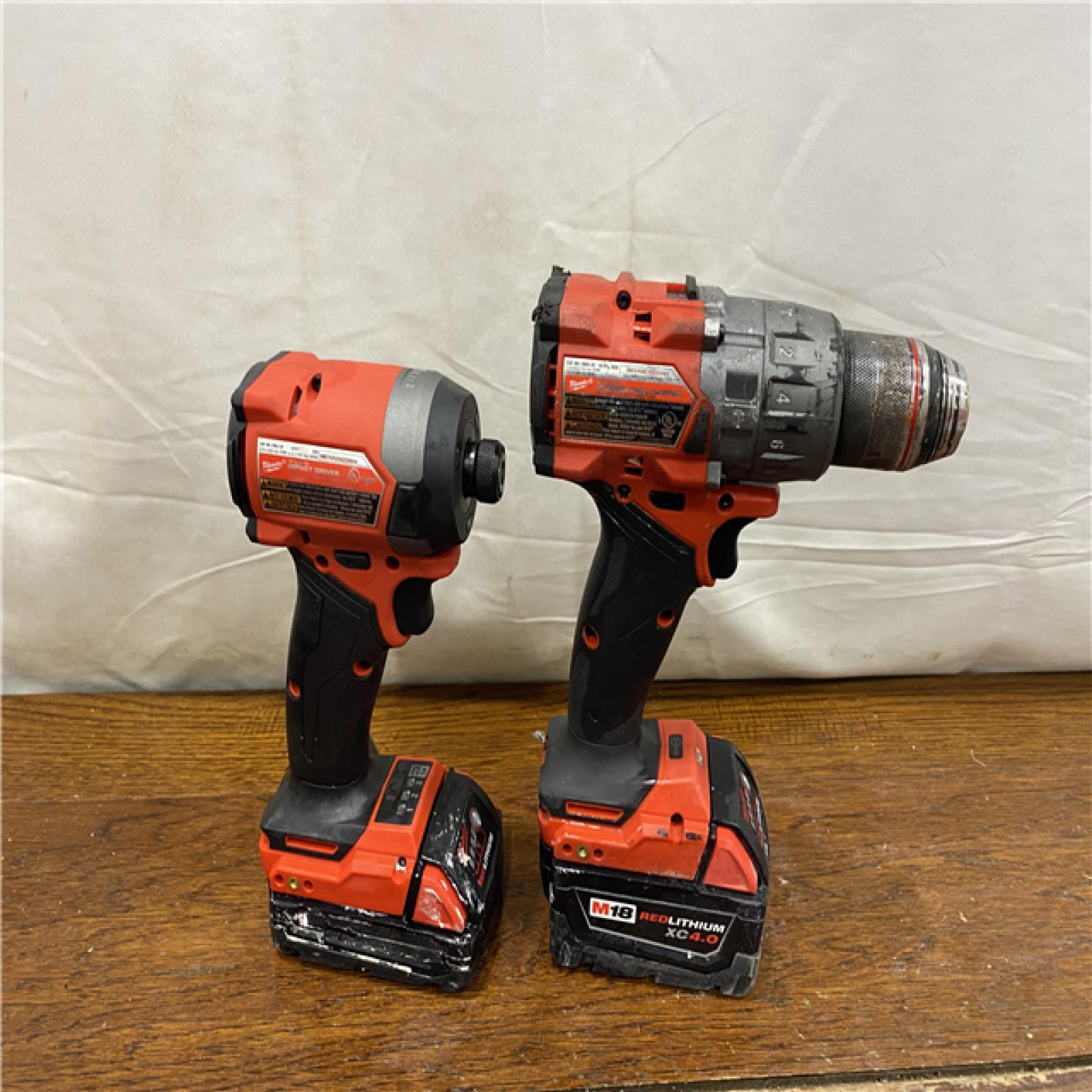 AS-IS MILWAUKEE M18 FUEL 18V Lithium-Ion Brushless Cordless Hammer Drill and Impact Driver Combo Kit (2-Tool) with 2 Batteries