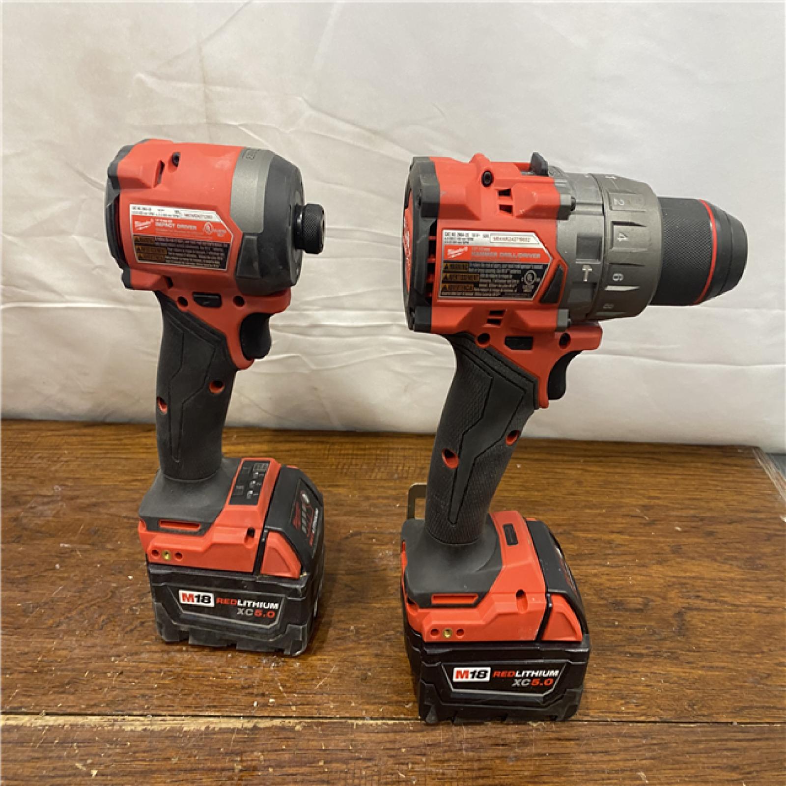 AS-IS MILWAUKEE M18 FUEL 18V Lithium-Ion Brushless Cordless Hammer Drill and Impact Driver Combo Kit (2-Tool) with 2 Batteries