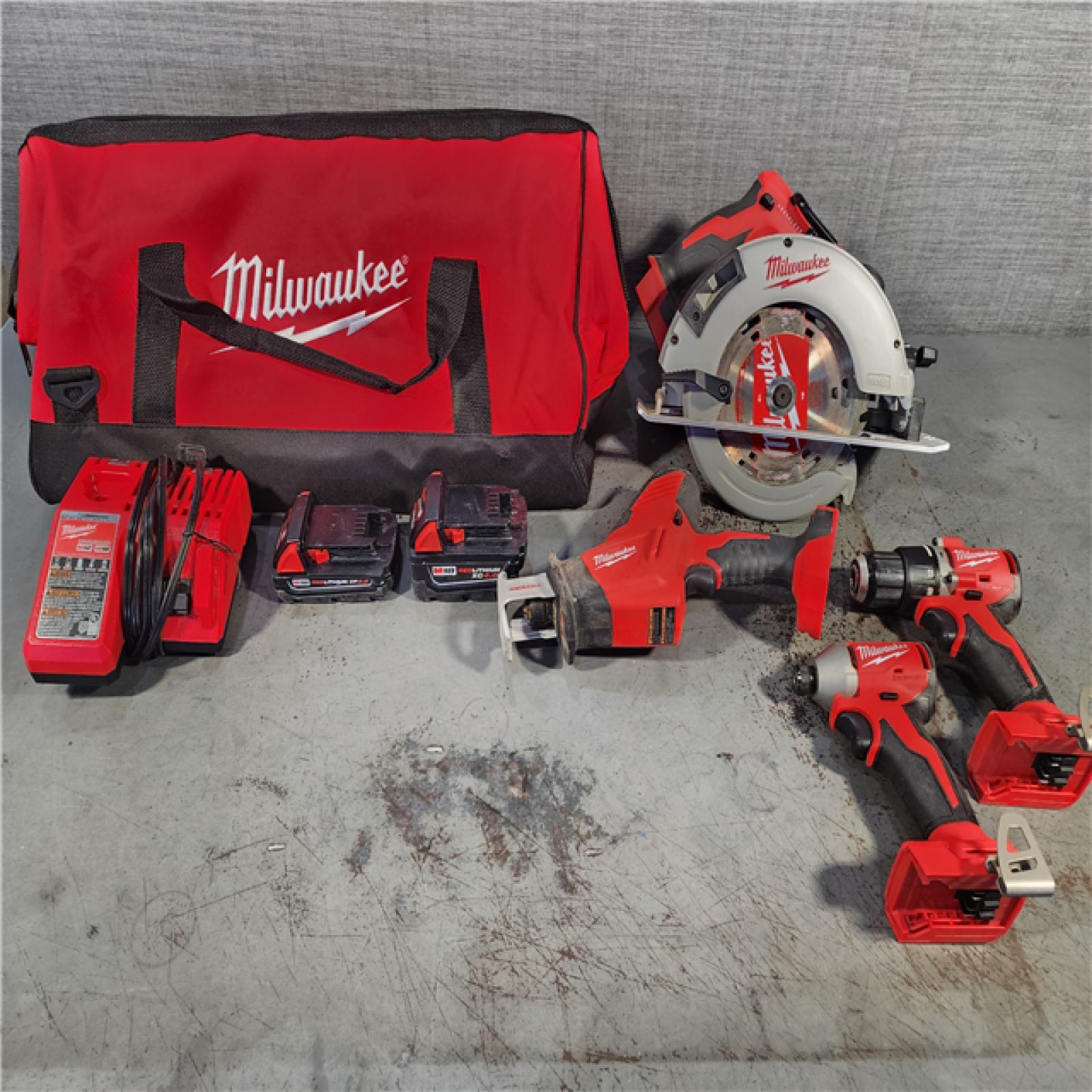 HOUSTON LOCATION - AS-IS AS-IS Milwaukee M18 18-Volt Lithium-Ion Brushless Cordless Combo Kit (4-Tool) with 2-Batteries, 1-Charger and Tool Bag