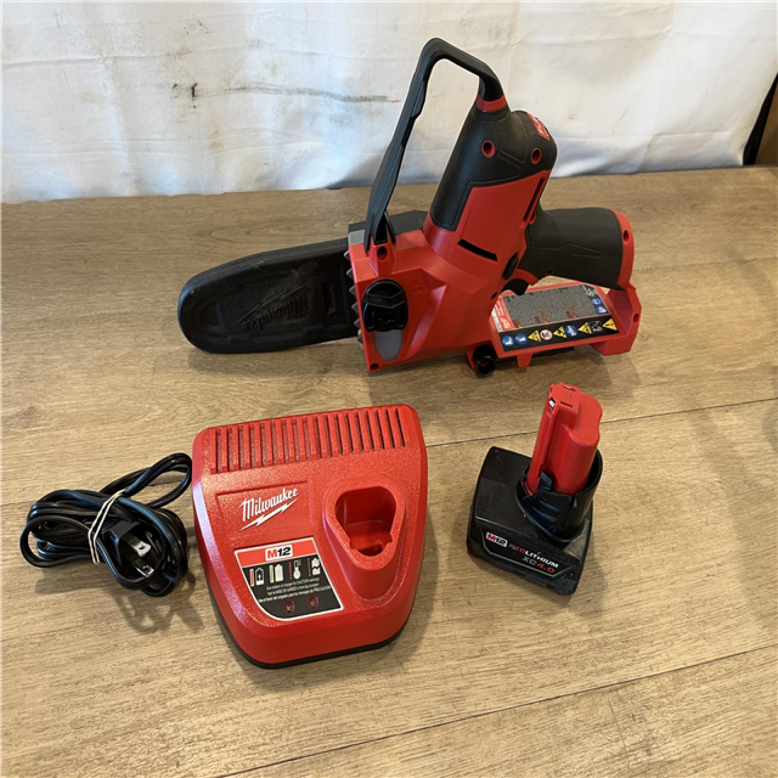 AS-IS Milwaukee FUEL 12V Lithium-Ion Brushless Battery 6 in. HATCHET Pruning Saw Kit