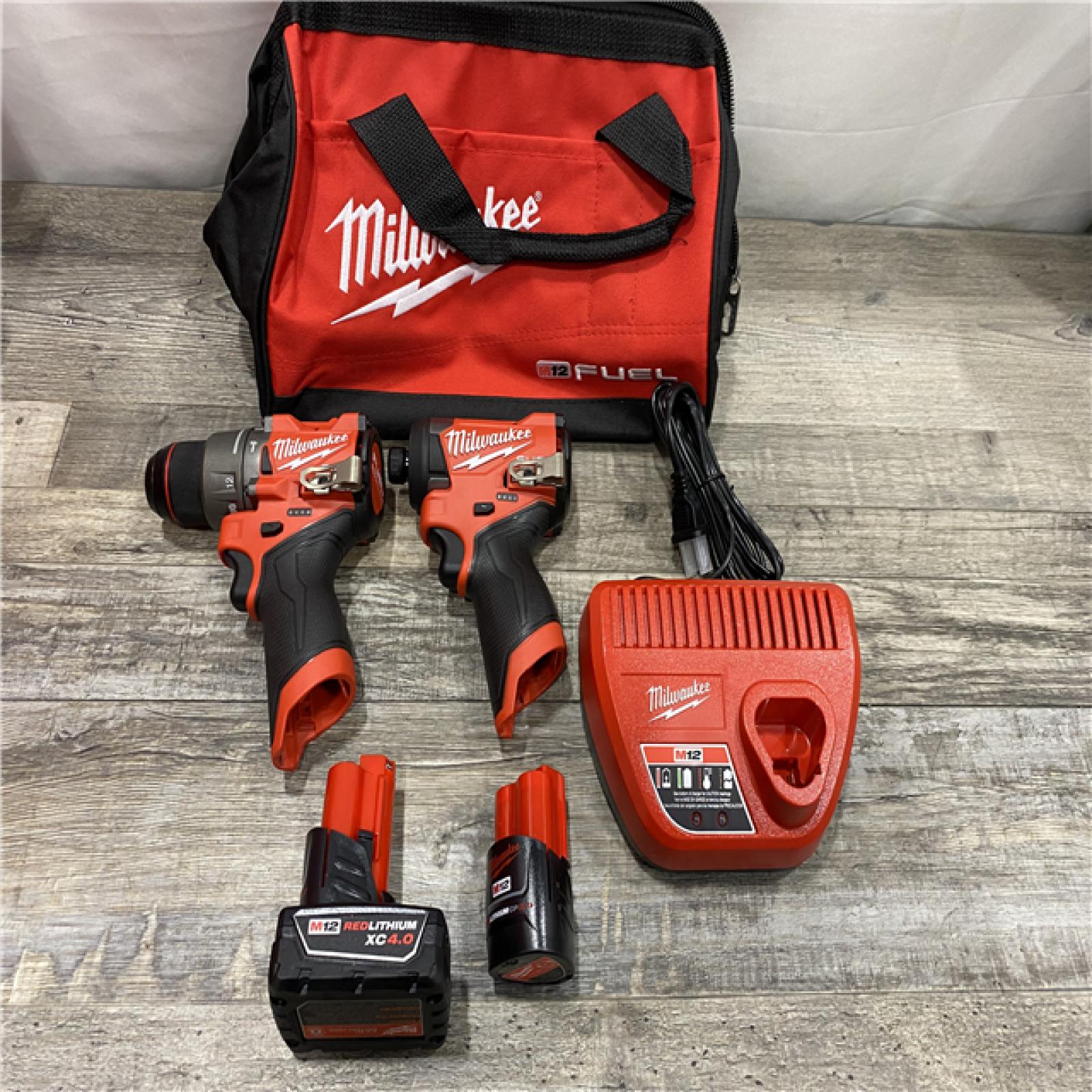 AS-IS Milwaukee FUEL 12-Volt Lithium-Ion Brushless Cordless Hammer Drill and Impact Driver Combo Kit