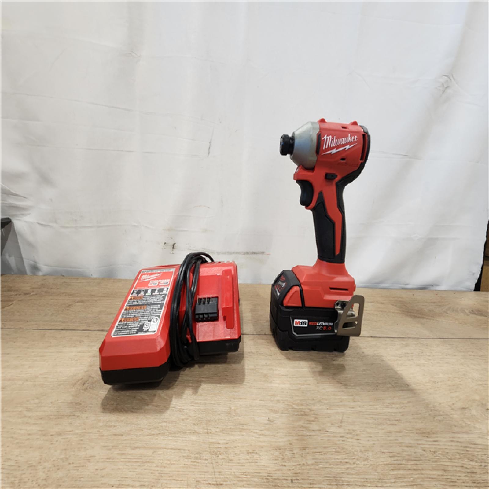 AS-IS- Milwaukee  M18 18-Volt Lithium-Ion Brushless Cordless 1/4 in. Compact Impact Driver with M18 5.0Ah Battery and Charger