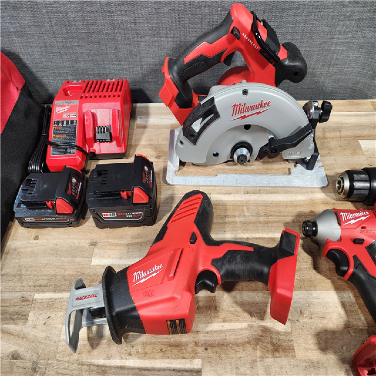 HOUSTON LOCATION - AS-IS MILWAUKEE 4 TOOL COMBO KIT W/ (2) BATTERY & CHARGER
