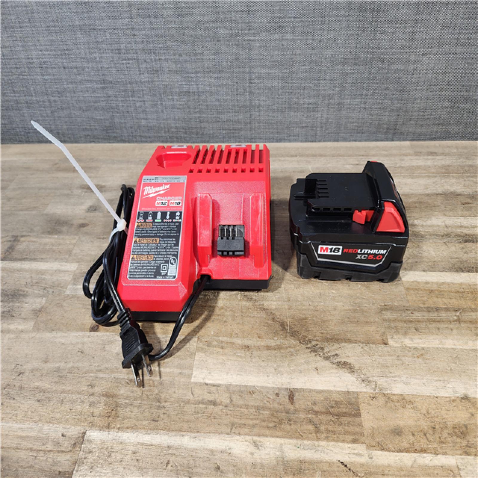 HOUSTON LOCATION - AS-IS Milwaukee M18 18V Fuel 1/2  Mid-Torque Impact Wrench Cordless Lithium-Ion Brushless with Friction Ring W/ BATTERY & CHARGER