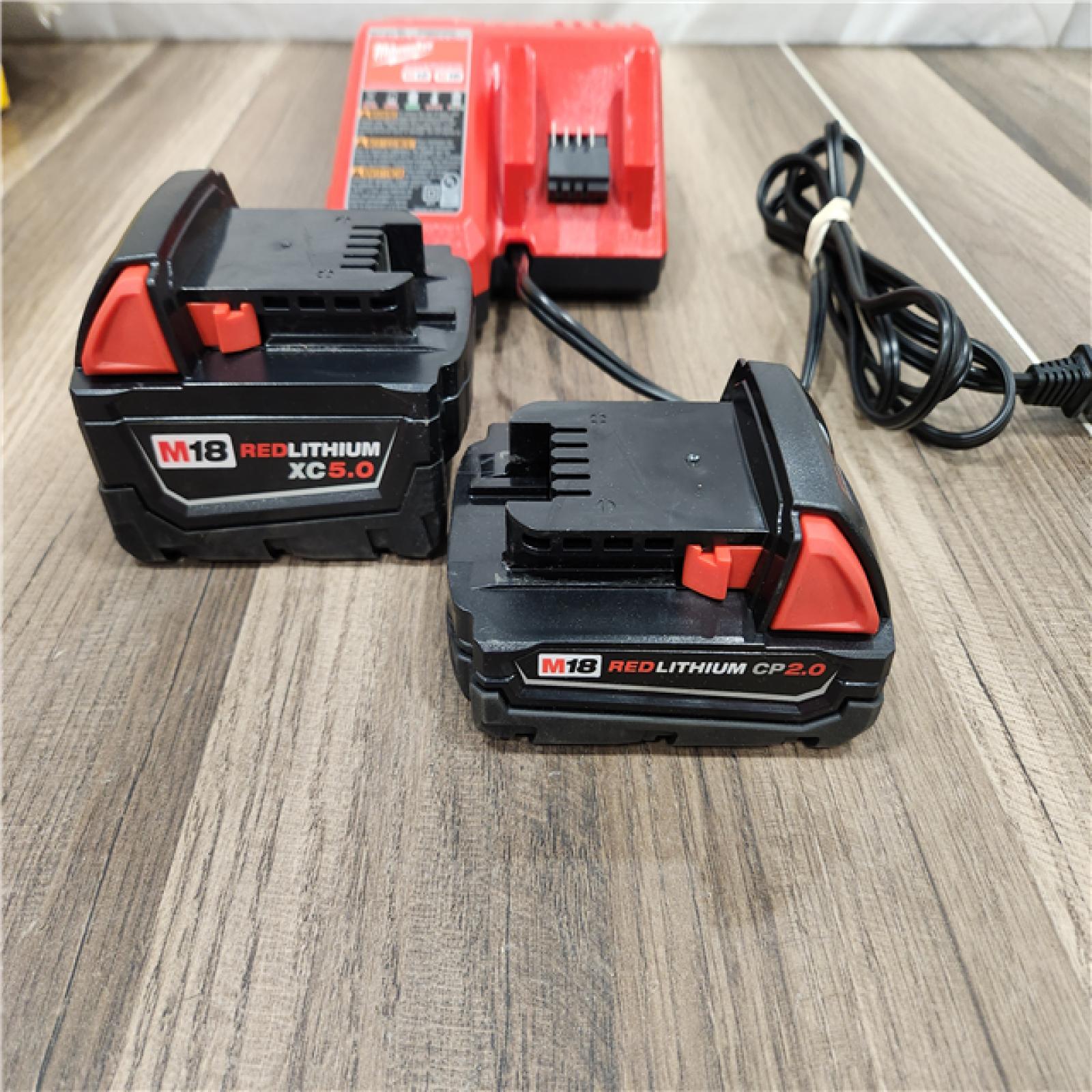 AS-IS Milwaukee M18 18-Volt Lithium-Ion Starter Kit with One 5.0 Ah and One 2.0 Ah Battery and Charger