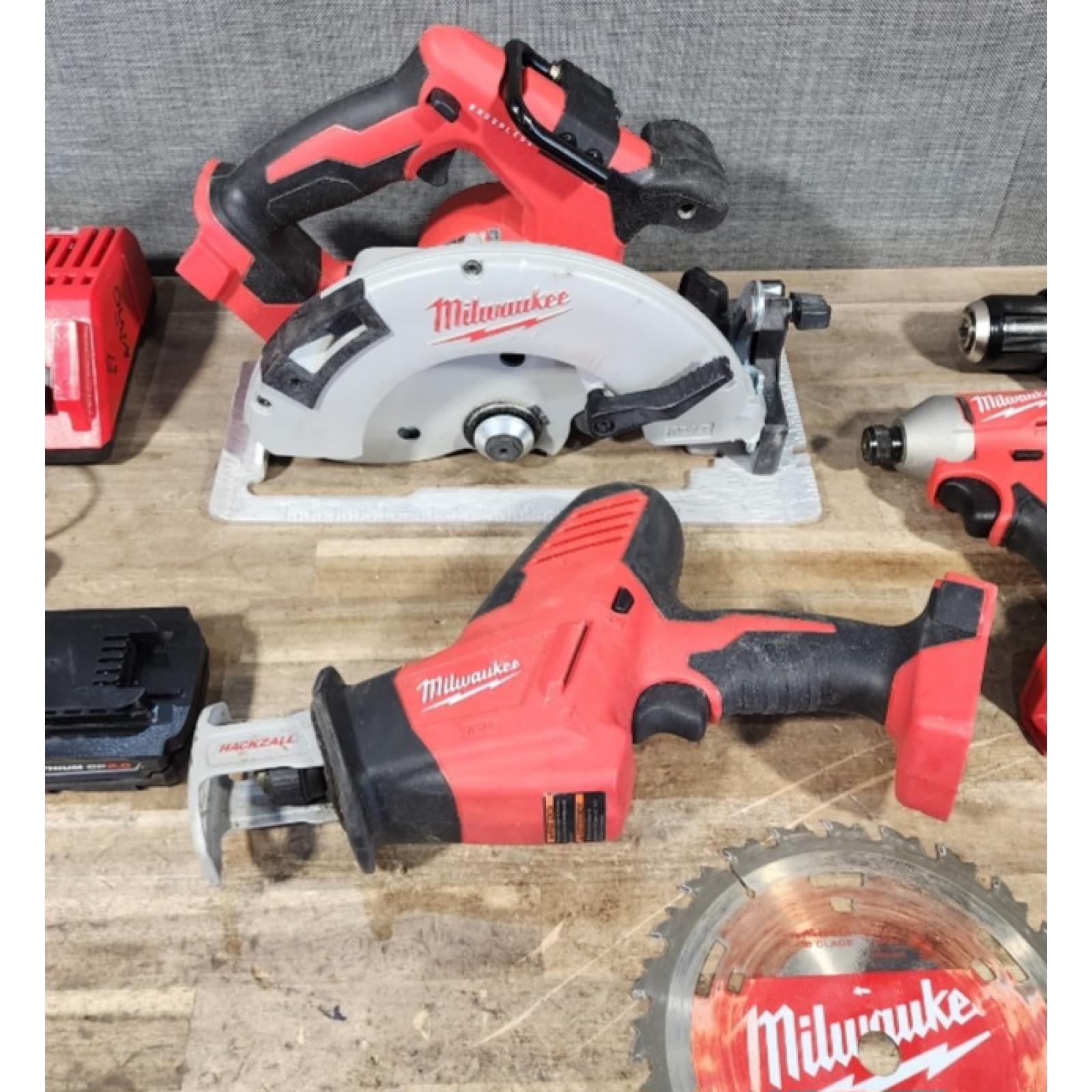 HOUSTON LOCATION - AS-IS Milwaukee M18 18-Volt Lithium-Ion Brushless Cordless Combo Kit (4-Tool) with 2-Batteries  1-Charger and Tool Bag