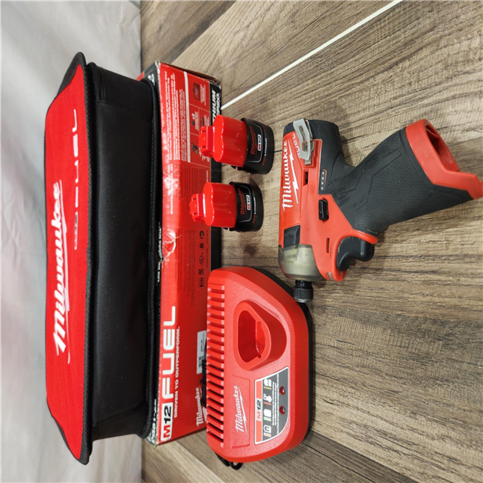 AS-IS Milwaukee M12 FUEL SURGE 12V Lithium-Ion Brushless Cordless 1/4 in. Hex Impact Driver Compact Kit W/Two 2.0Ah Batteries, Bag