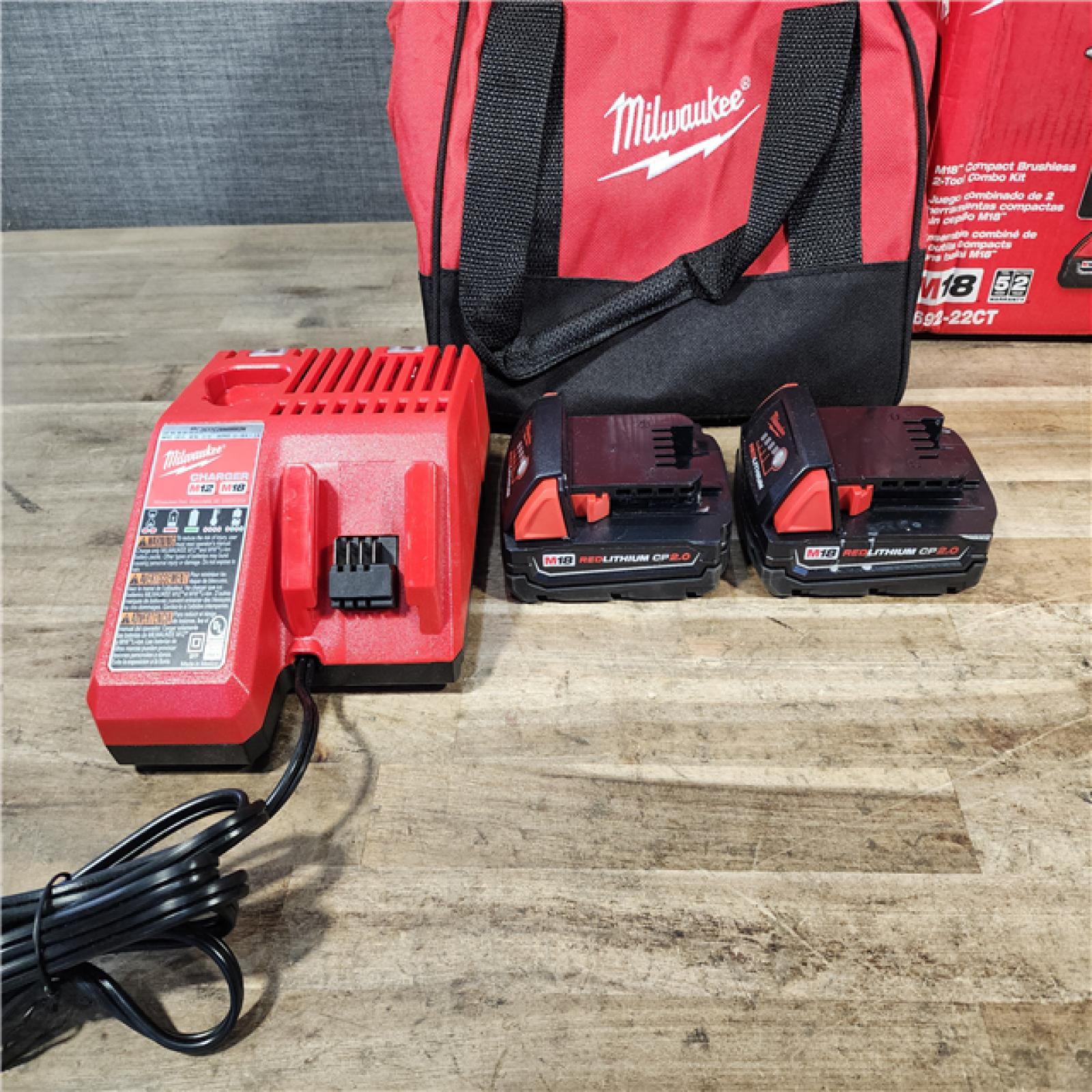 HOUSTON LOCATION - AS-IS Milwaukee M18 18V Lithium-Ion Brushless Cordless Compact Drill/Impact Combo Kit (2-Tool) W/(2) 2.0 Ah Batteries  Charger & Bag