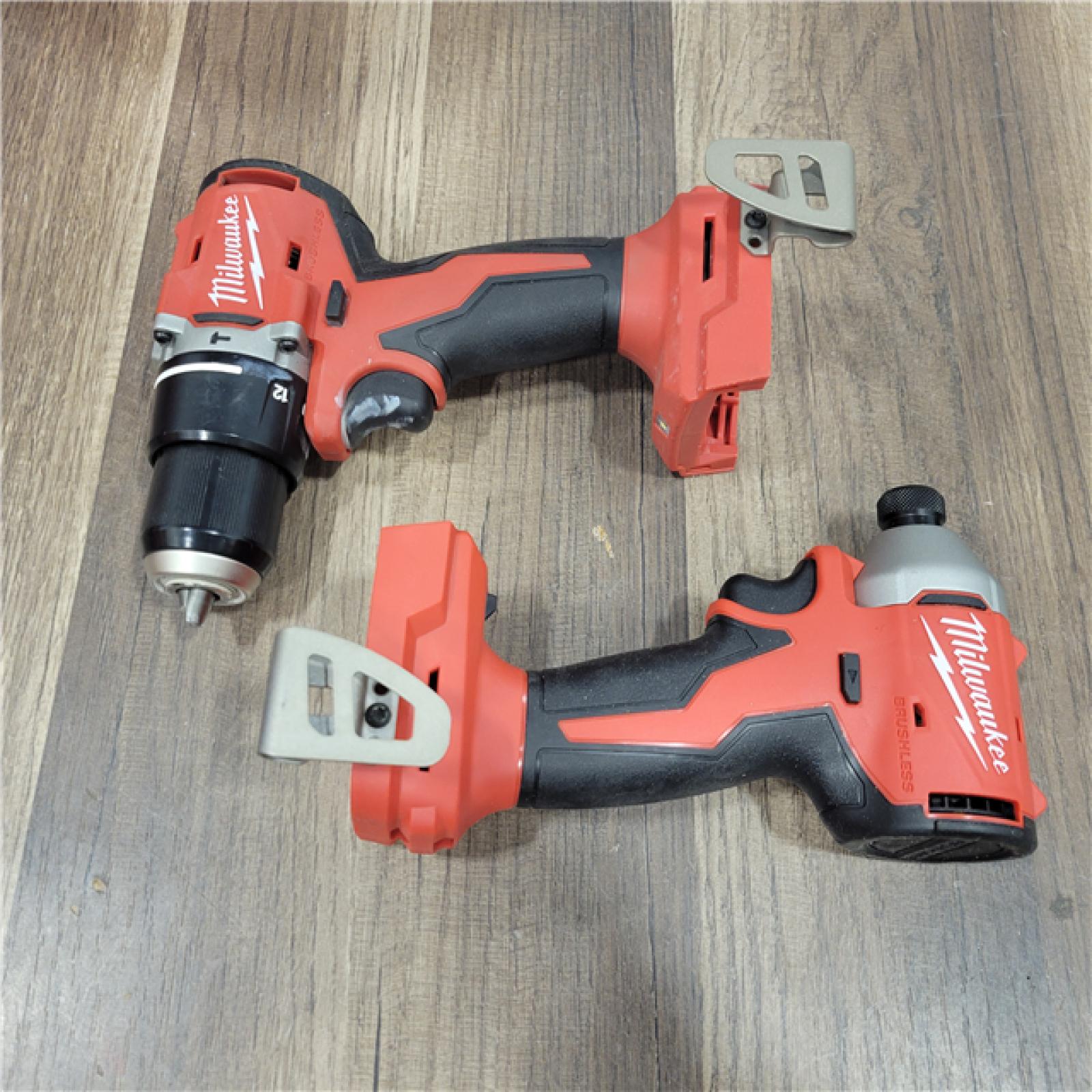 AS-IS Milwaukee   M18 18-Volt Lithium-Ion Brushless Cordless Compact Hammer Drill/Impact Combo Kit (2-Tool) with (2) Batteries, Bag