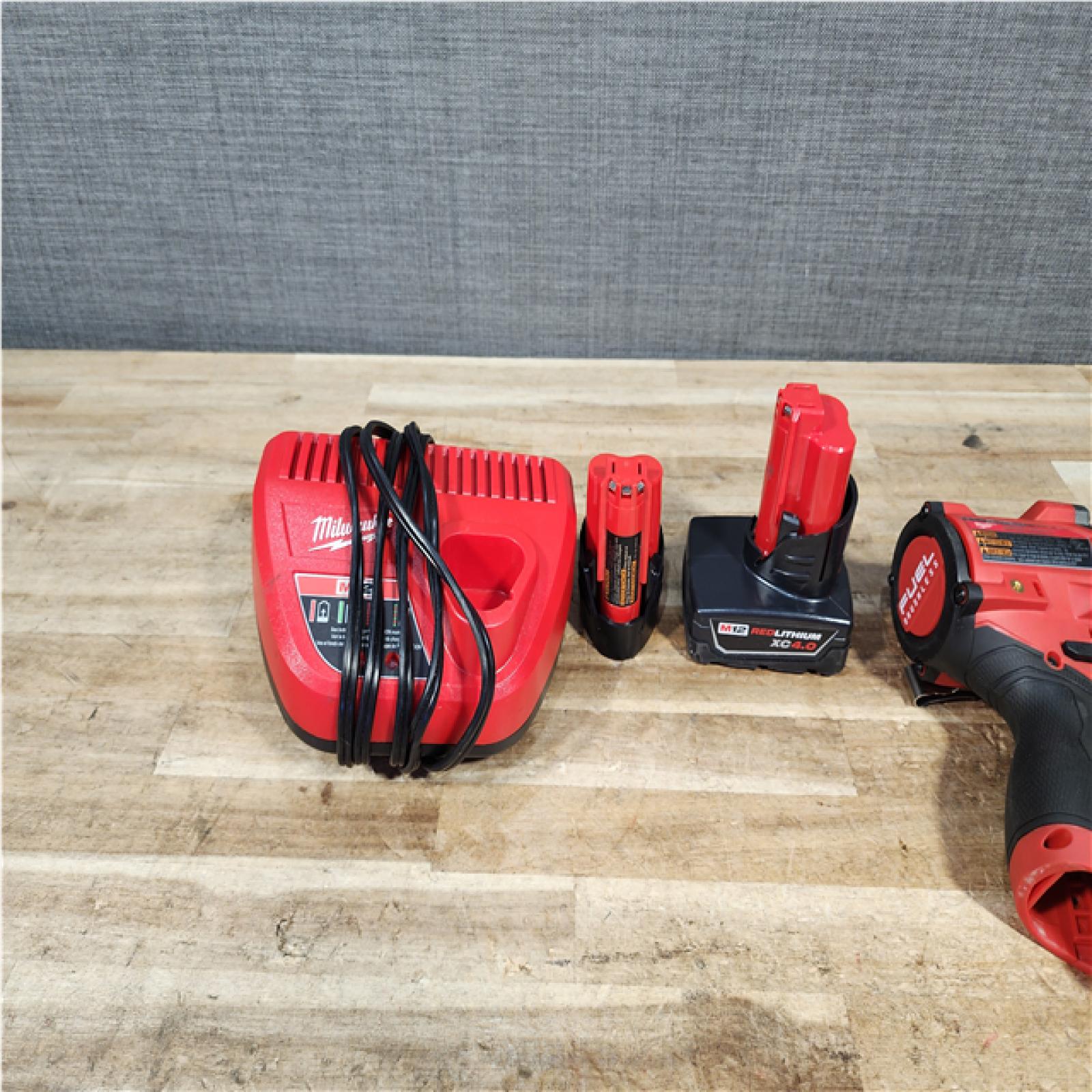 HOUSTON LOCATION - AS - IS Milwaukee FUEL 12V Li-Ion Brushless Cordless Stubby 3/8 in. Impact Wrench Kit