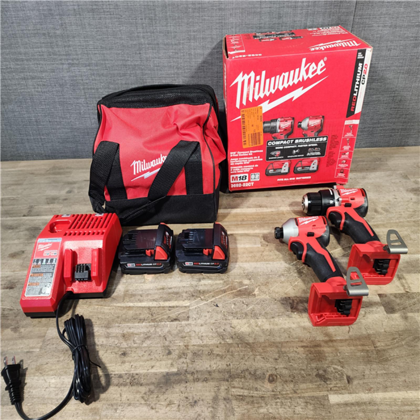HOUSTON LOCATION - AS-IS Milwaukee M18 18V Lithium-Ion Brushless Cordless Compact Drill/Impact Combo Kit (2-Tool) W/(2) 2.0 Ah Batteries  Charger & Bag