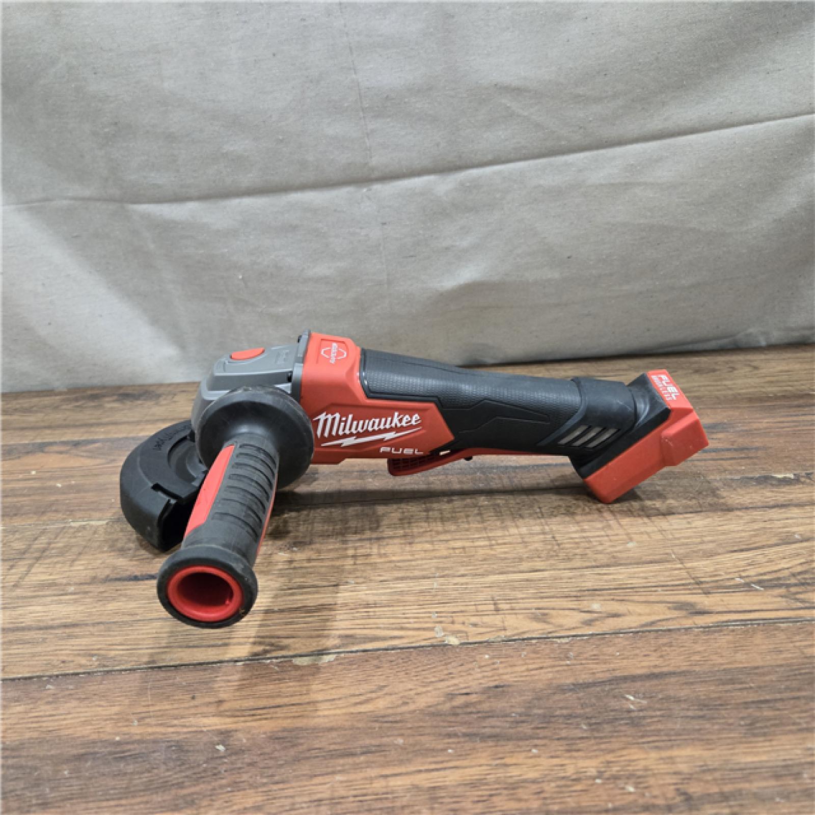 AS-IS Milwaukee 2880-20 FUEL 18-Volt Lithium-Ion Brushless Cordless 4-1/2 in./5 in. Grinder W/Paddle Switch (Tool-Only)