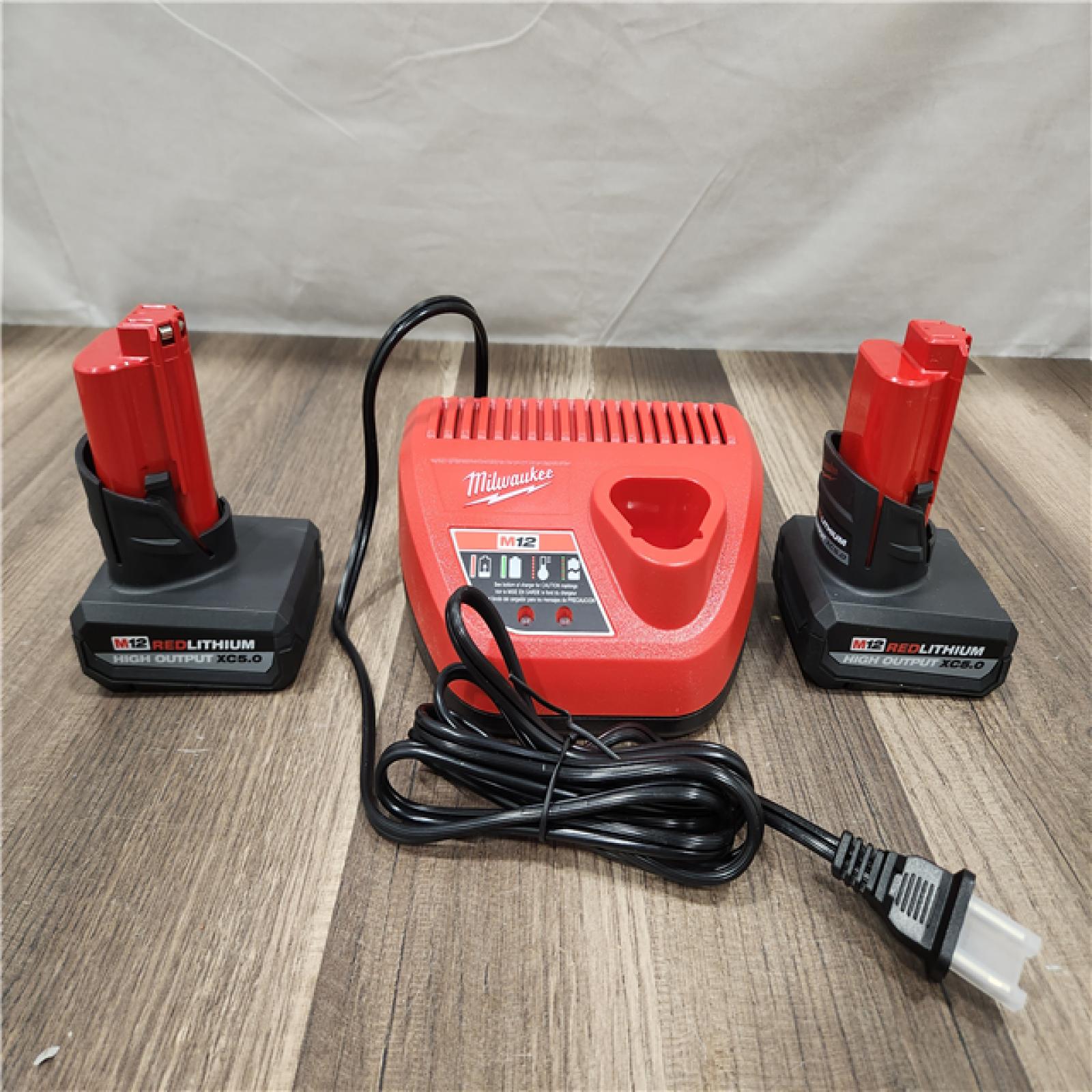 AS-IS- Milwaukee M12 12V Lithium-Ion XC High Output 5.0 Ah Battery Pack (2-Pack) Starter Kit with Charger