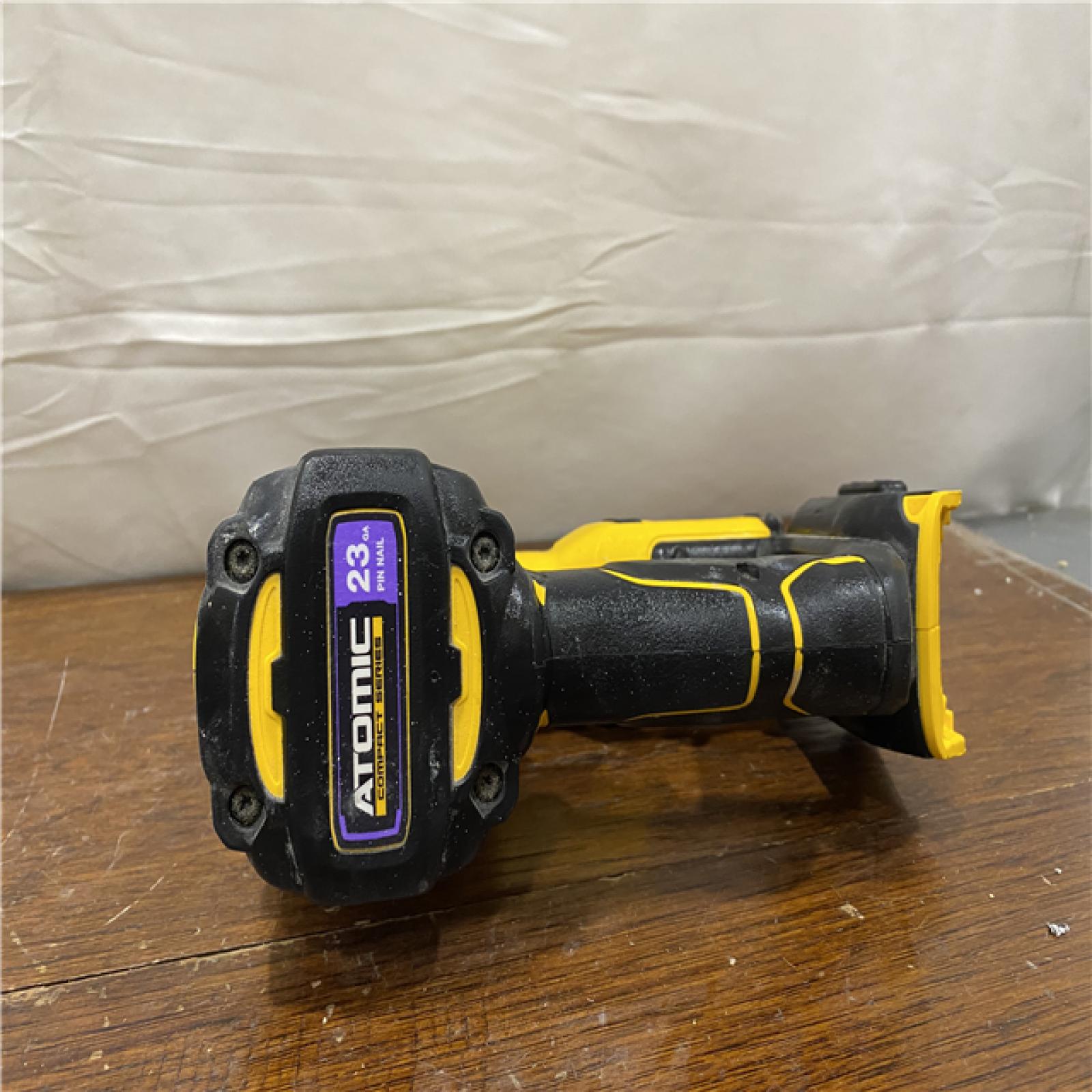 AS-IS DeWalt DCN623D1 20-Volt MAX Atomic Compact Cordless Pin Nailer Kit  Brushless Motor  23 Gauge  Battery - Quantity 1