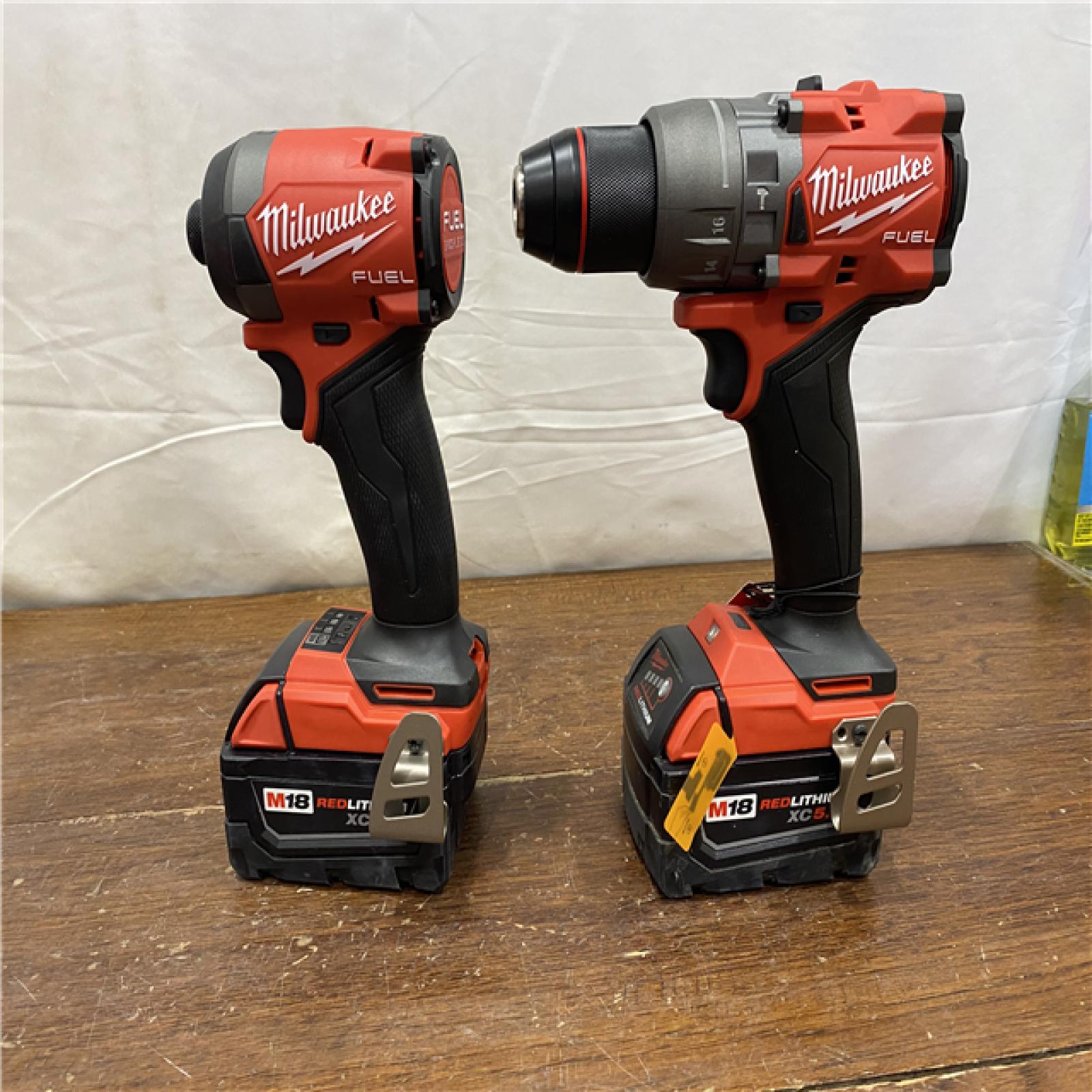 AS-IS MILWAUKEE M18 FUEL 18V Lithium-Ion Brushless Cordless Hammer Drill and Impact Driver Combo Kit (2-Tool) with 2 Batteries