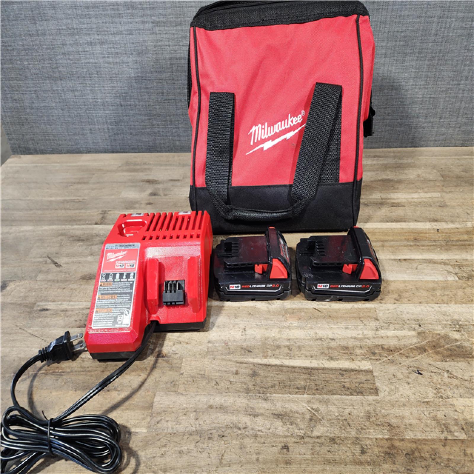 HOUSTON LOCATION - AS-IS Milwaukee M18 18V Lithium-Ion Brushless Cordless Compact Drill/Impact Combo Kit (2-Tool) W/(2) 2.0 Ah Batteries  Charger & Bag