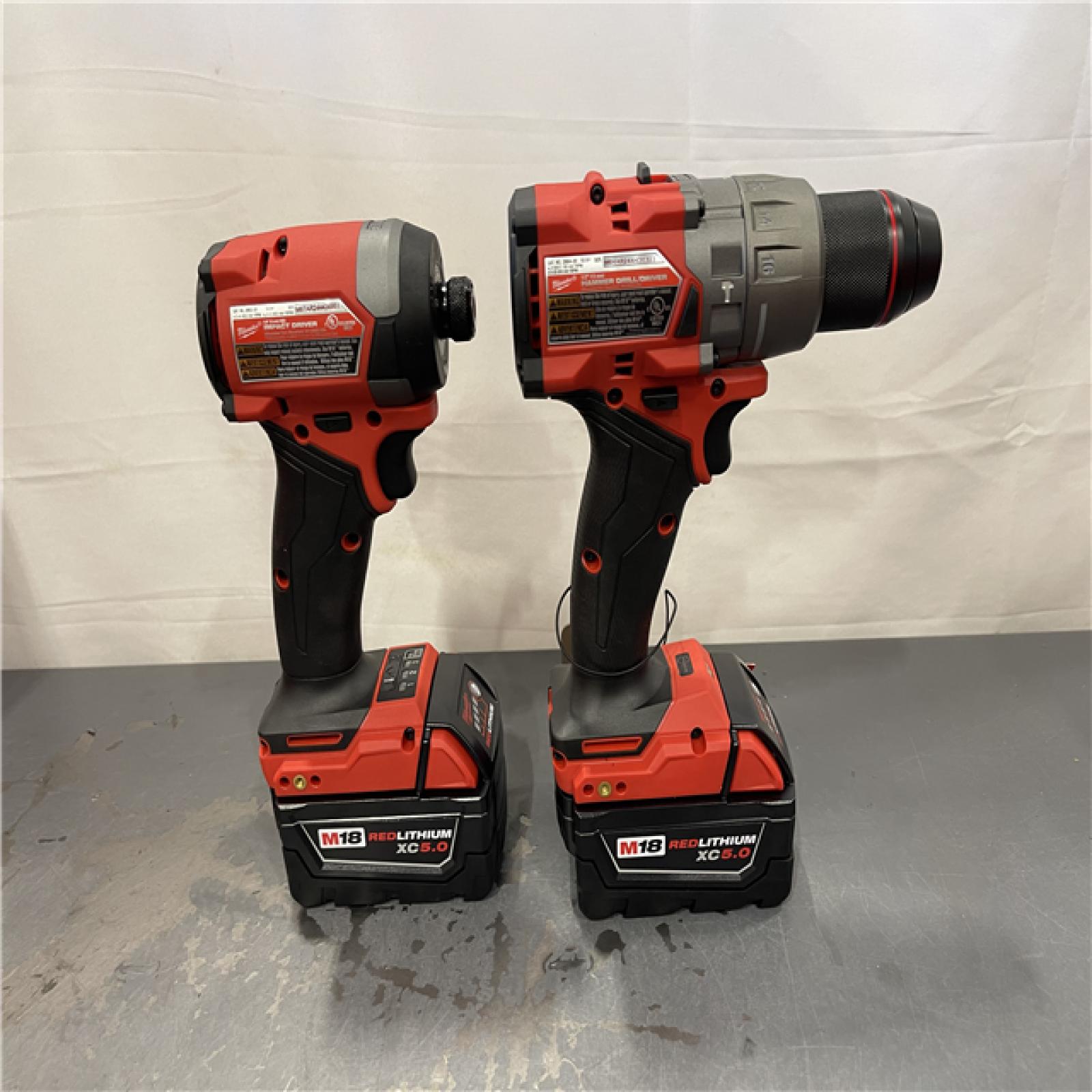 AS-IS - Milwaukee M18 FUEL 18V Lithium-Ion Brushless Cordless Hammer Drill and Impact Driver Combo Kit