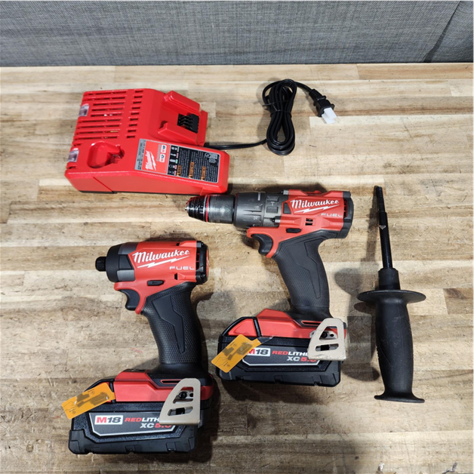 Houston Location AS-IS  Milwaukee FUEL 18V Lithium-Ion Brushless Cordless Hammer Drill and Impact Driver Combo Kit
