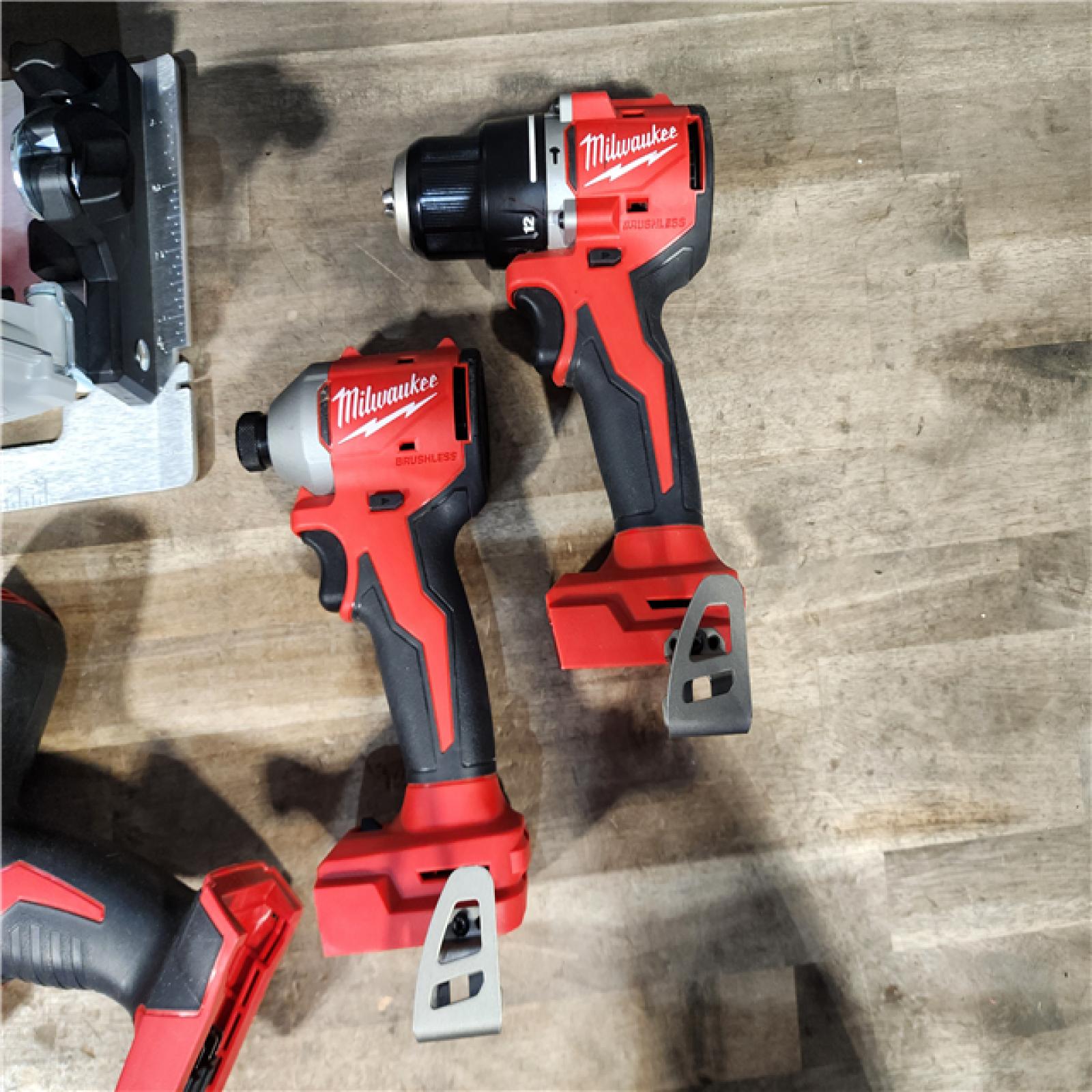 HOUSTON LOCATION - AS-IS Milwaukee M18 18-Volt Lithium-Ion Brushless Cordless Combo Kit (4-Tool) with 2-Batteries  1-Charger
