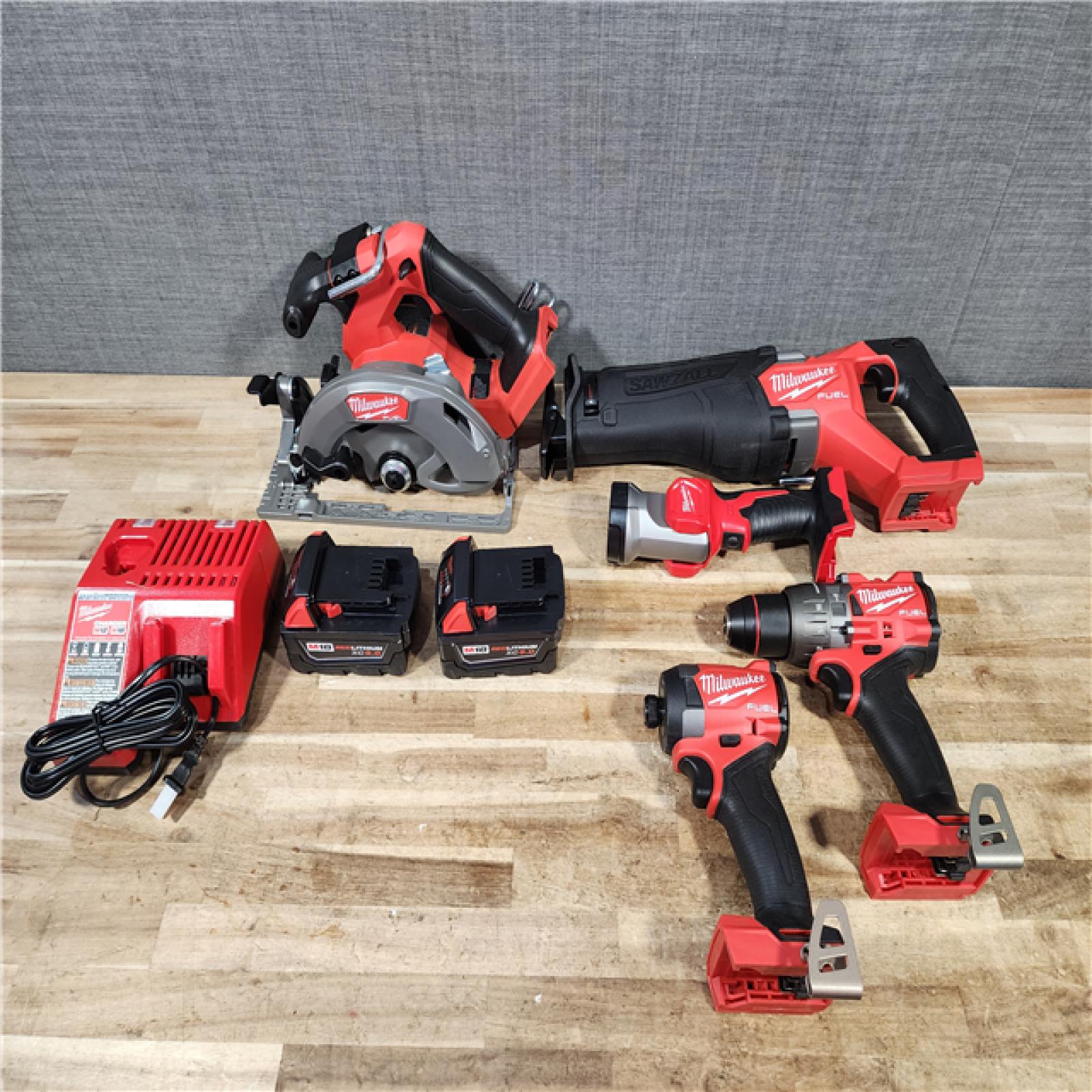 HOUSTON LOCATION - AS - IS M18 FUEL 18V Lithium-Ion Brushless Cordless 5-Tool Combo Kit with Two 5.0 Ah Batteries  1 Charger 1 Tool Bag