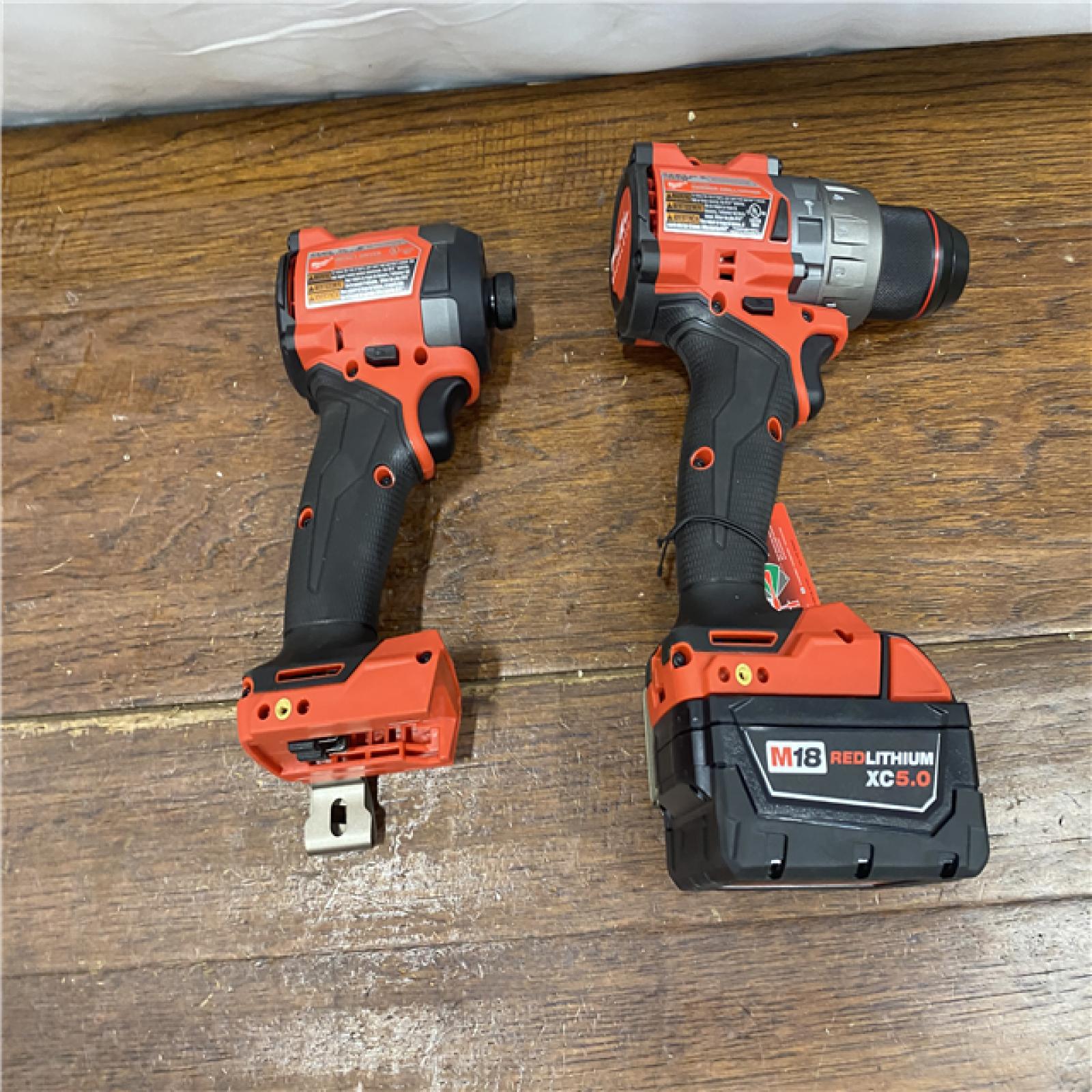 AS-IS MILWAUKEE M18 FUEL 18V Lithium-Ion Brushless Cordless Hammer Drill and Impact Driver Combo Kit (2-Tool) with 2 Batteries