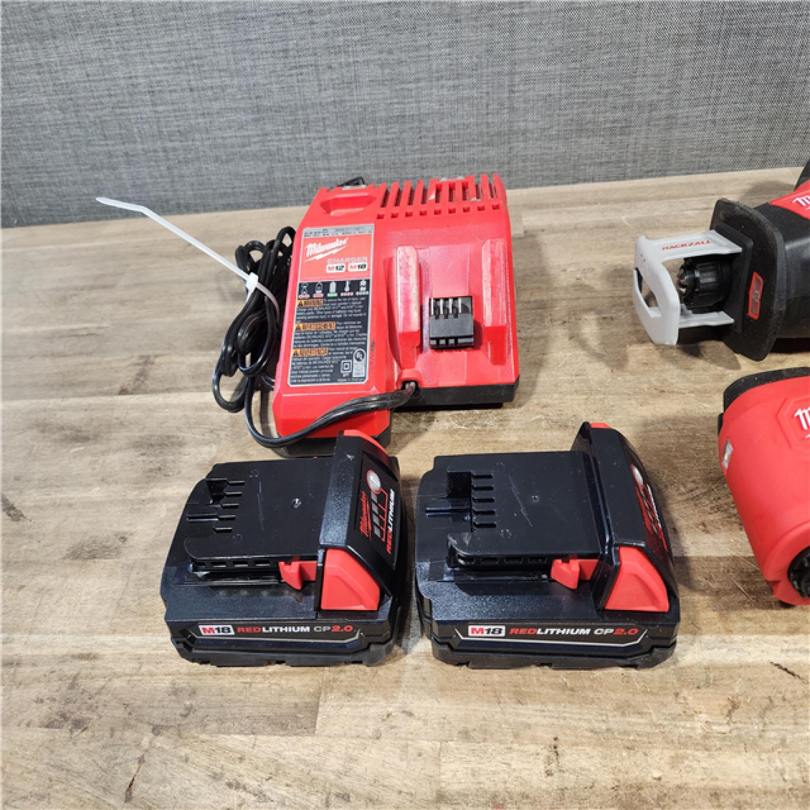 HOUSTON LOCATION - AS-IS MILWAUKEE 4 TOOL COMBO KIT W/ (2) BATTERY & CHARGER
