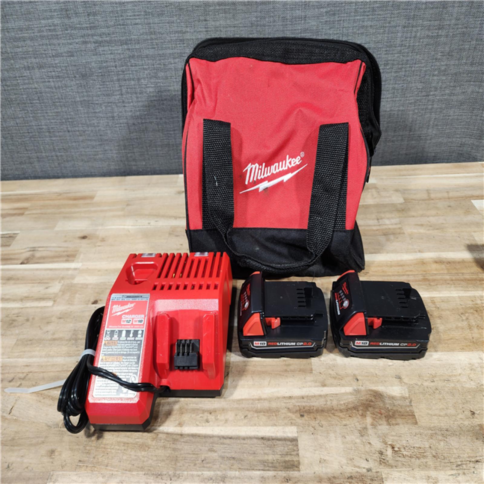 HOUSTON LOCATION - AS-IS Milwaukee M18 18V Lithium-Ion Brushless Cordless Compact Drill/Impact Combo Kit (2-Tool) W/(2) 2.0 Ah Batteries  Charger & Bag