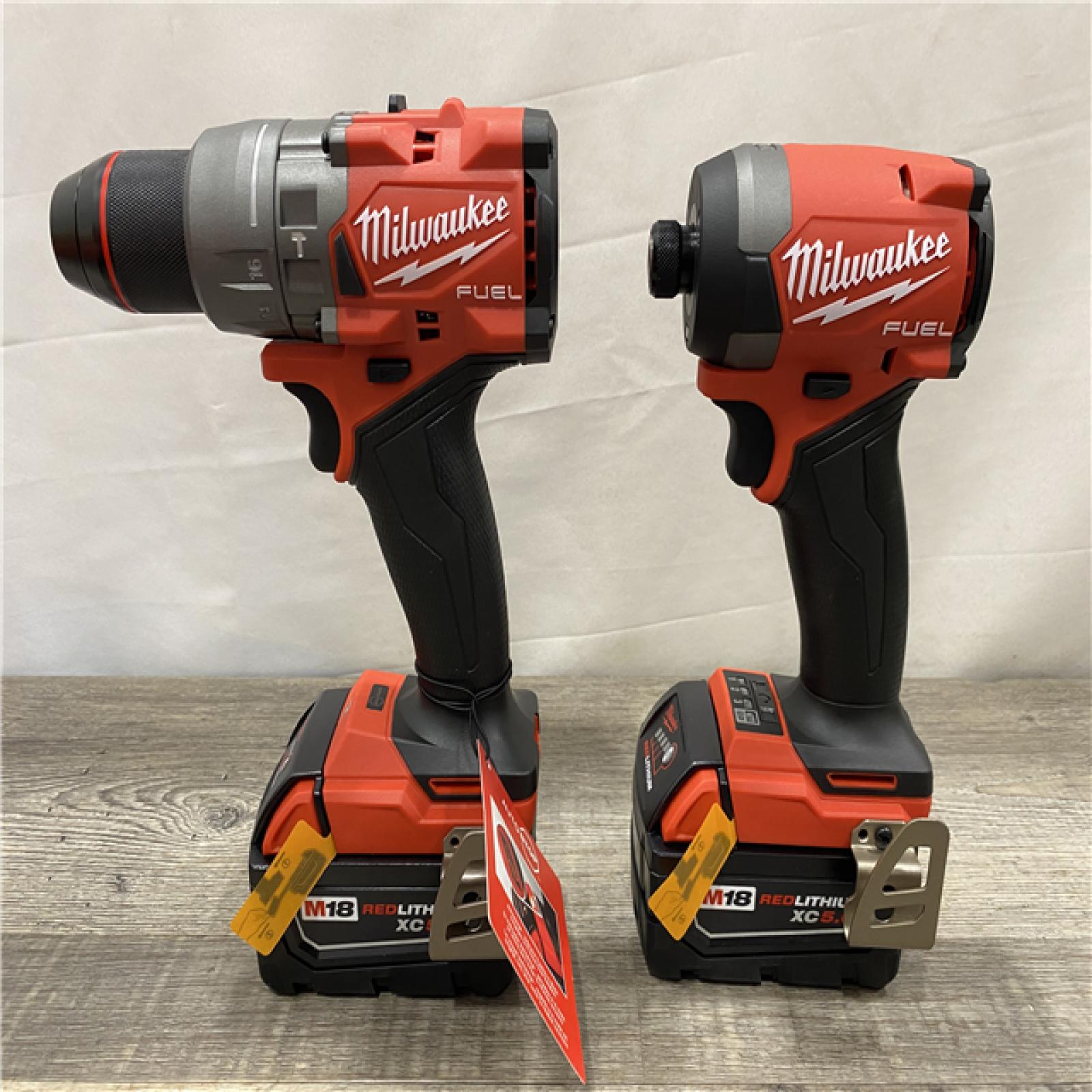 AS-IS Milwaukee FUEL 18V Lithium-Ion Brushless Cordless Hammer Drill and Impact Driver Combo Kit