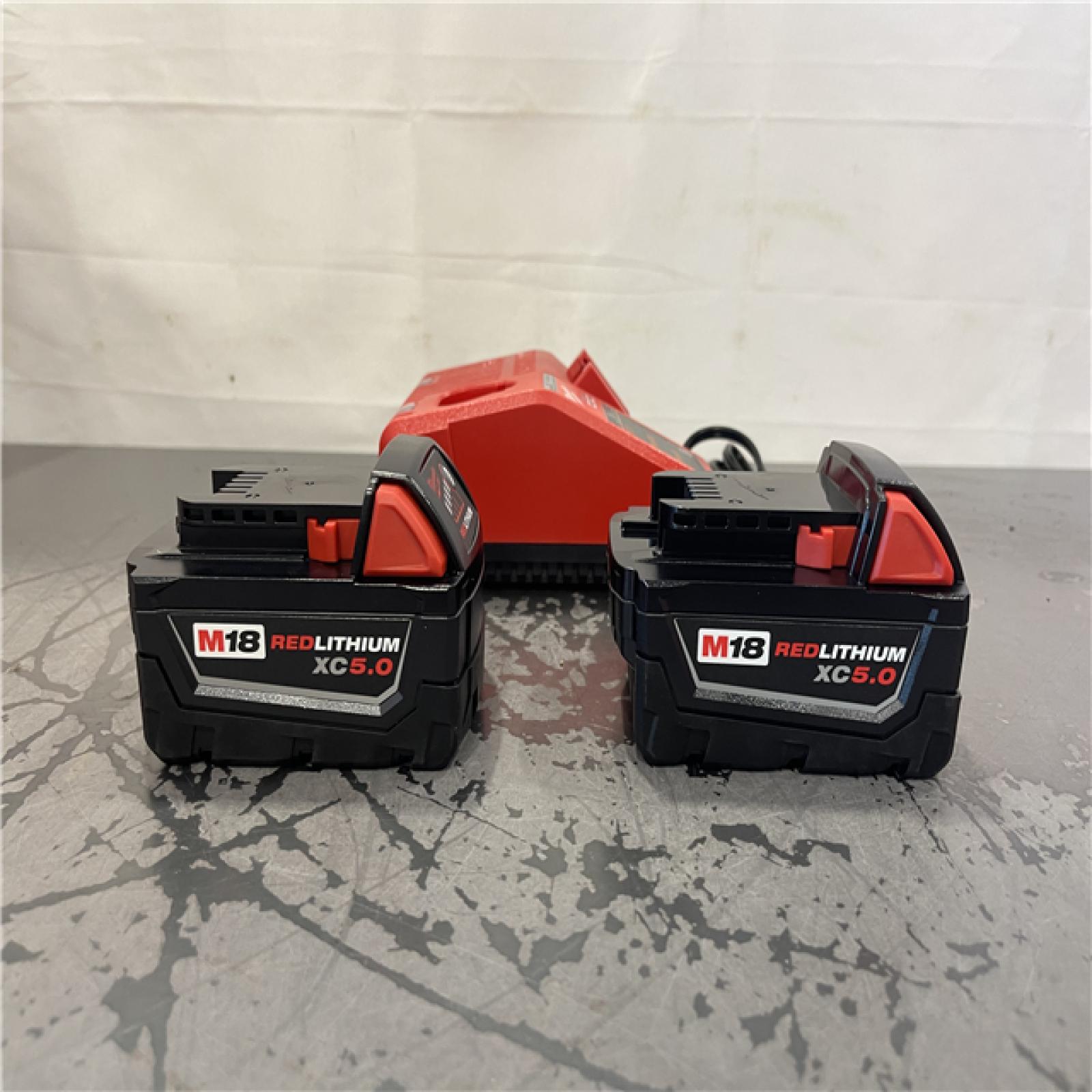 AS-IS- Milwaukee M18 18-Volt Lithium-Ion XC Starter Kit with Two 5.0Ah Batteries and Charger
