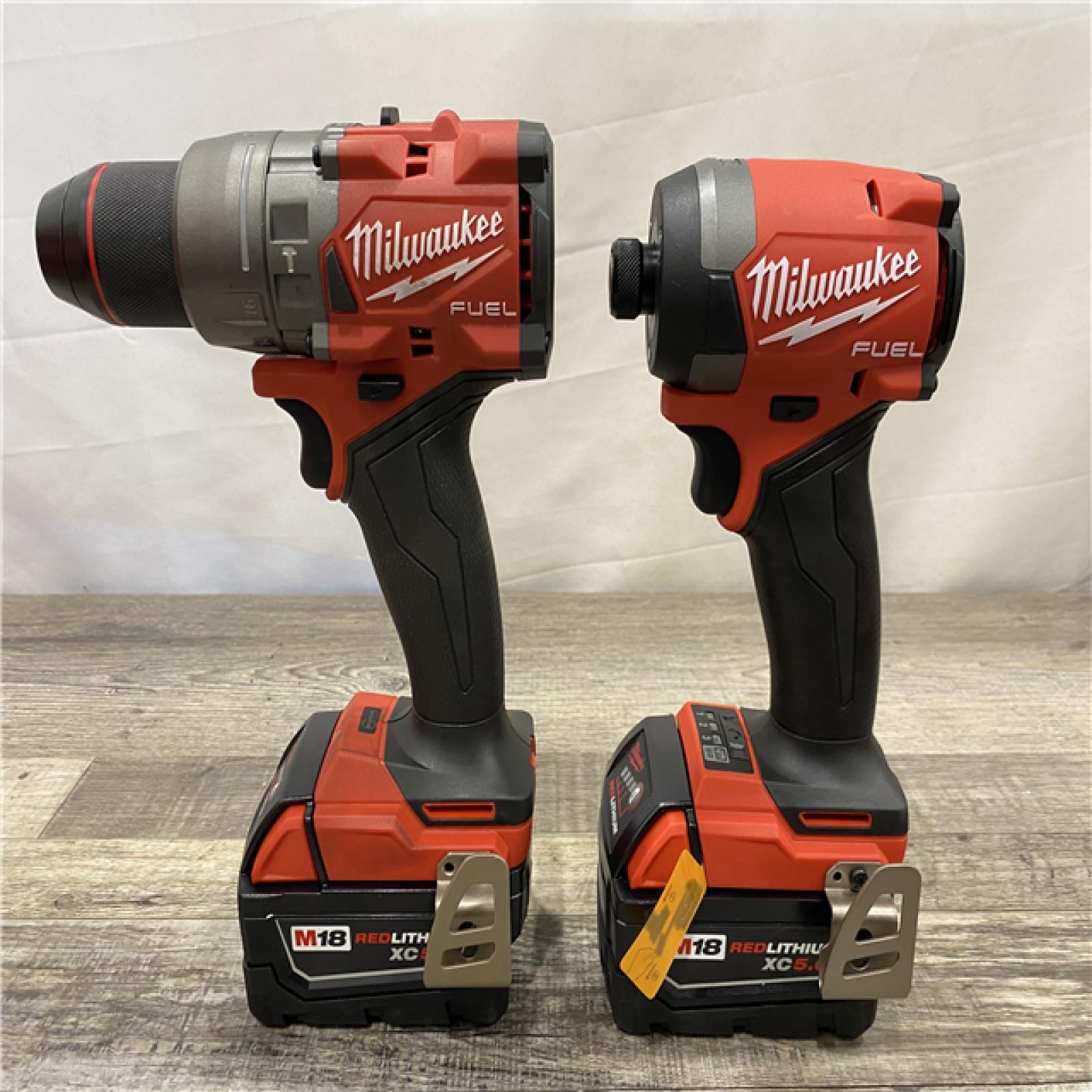 AS-IS Milwaukee FUEL 18V Lithium-Ion Brushless Cordless Hammer Drill and Impact Driver Combo Kit