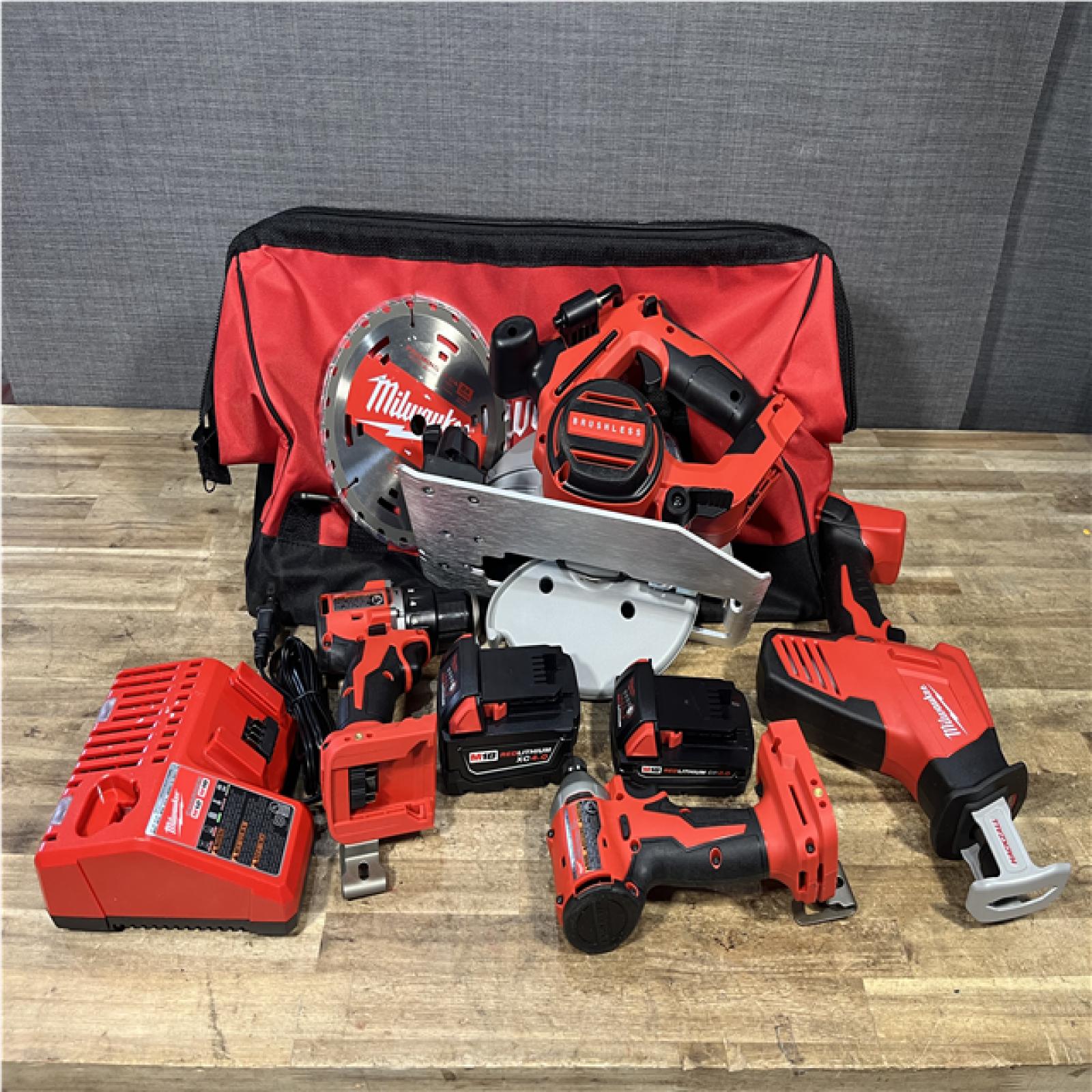 Houston Location AS-IS Milwaukee Hammer Drill Driver and Impact Driver Hackzall and Circular Saw and Batteries QTY/2 with Charger