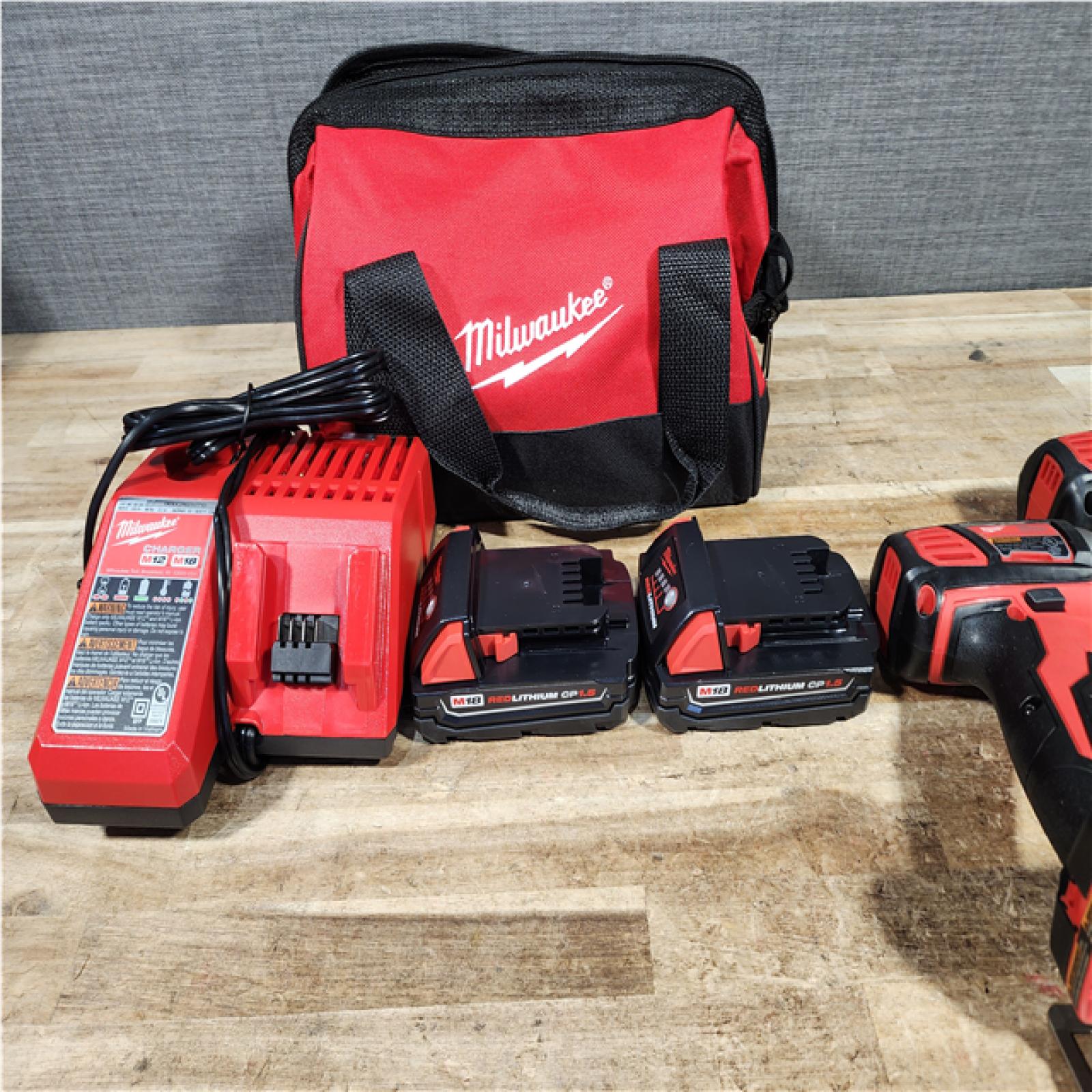 HOUSTON LOCATION - AS - IS Milwaukee 18V Lithium-Ion Cordless Drill Driver/Impact Driver Combo Kit