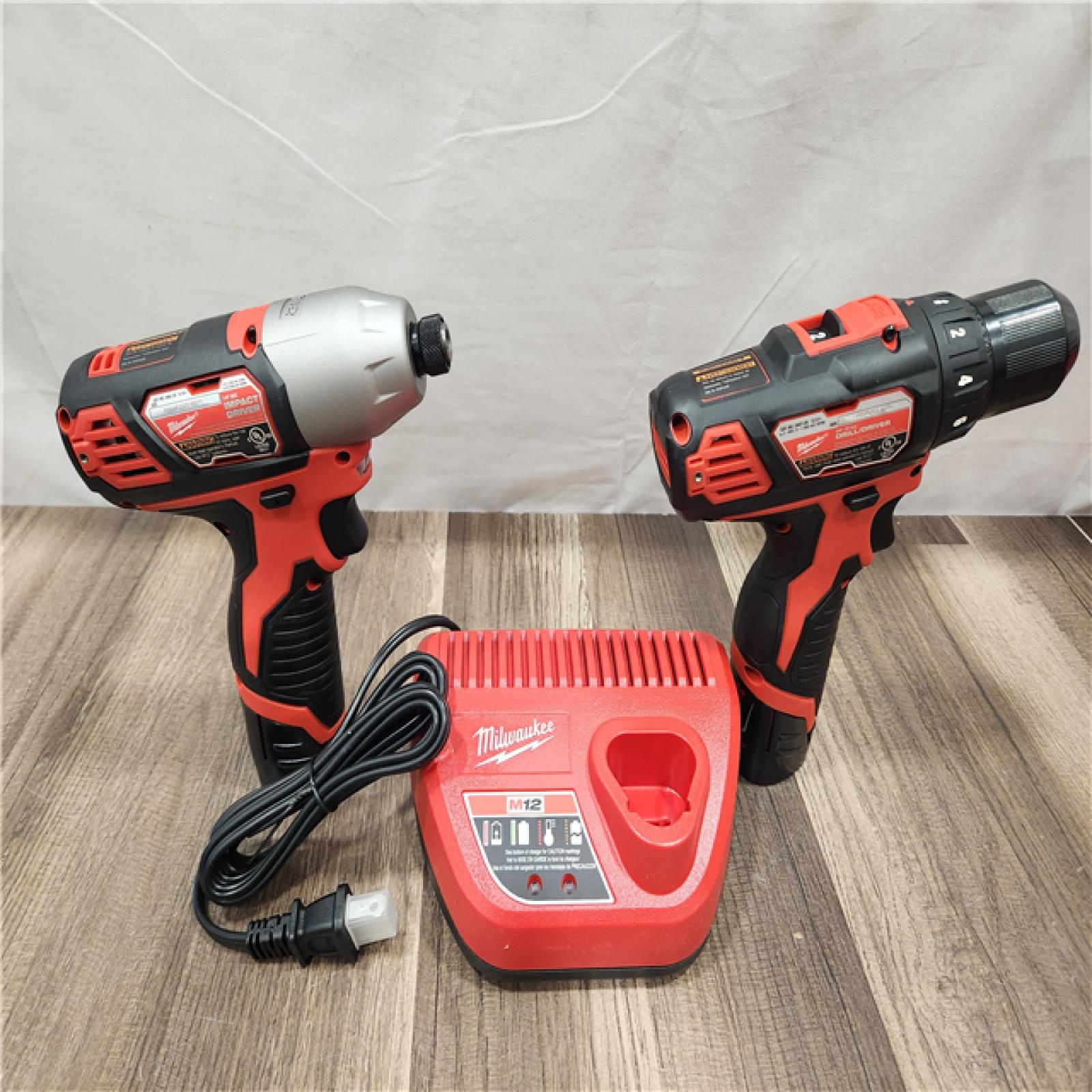 AS-IS- Milwaukee M12 Cordless Combination 3/8  Drill / Driver and 1/4  Hex Impact Driver Dual Power Tool Kit (2 Lithium Ion Batteries  Charger  and B