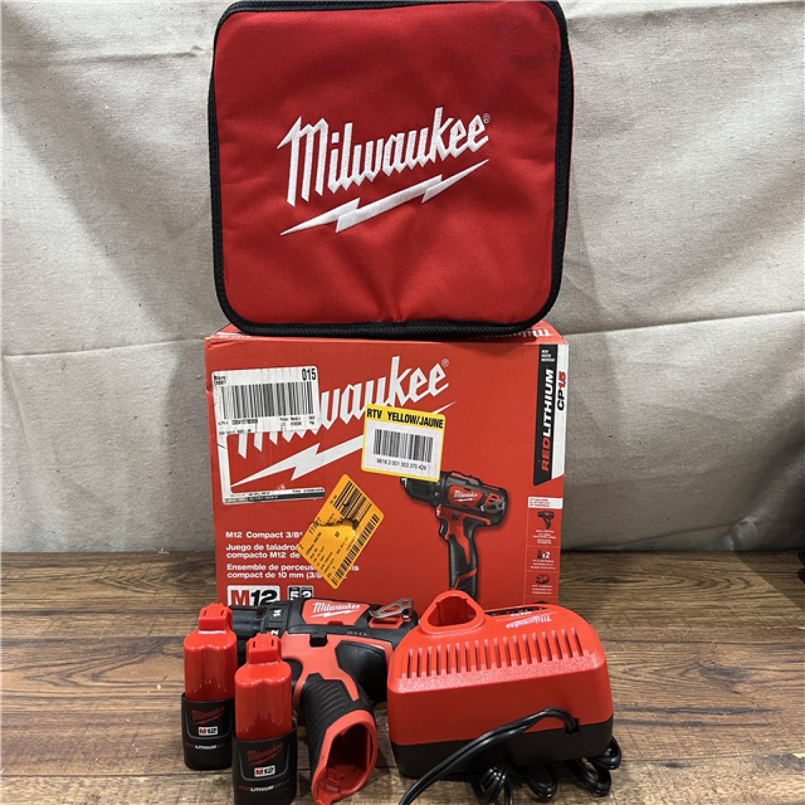 AS-IS MILWAUKEE M12 12V Lithium-Ion Cordless 3/8 in. Drill/Driver Kit with Two 1.5 Ah Batteries, Charger and Tool Bag