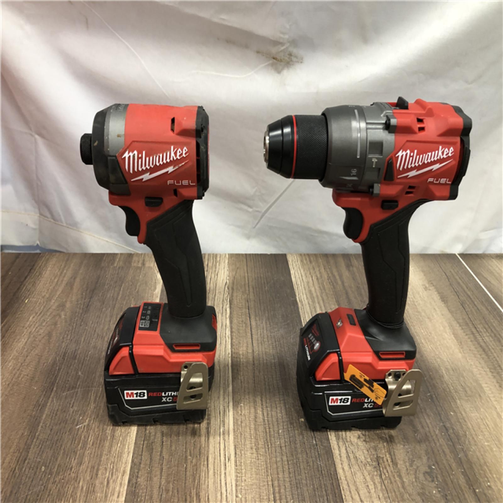AS-IS Milwaukee FUEL 18V Lithium-Ion Brushless Cordless Hammer Drill and Impact Driver Combo Kit