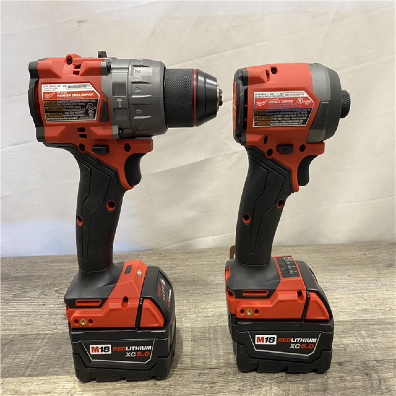 AS-IS Milwaukee FUEL 18V Lithium-Ion Brushless Cordless Hammer Drill and Impact Driver Combo Kit