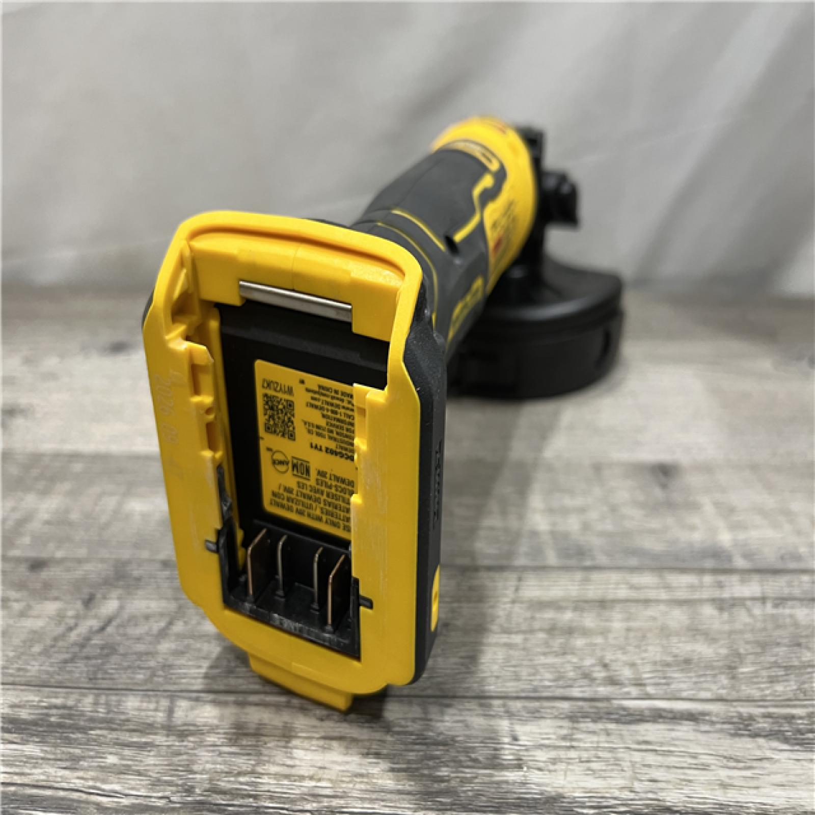 AS-IS DEWALT ATOMIC 20V MAX Cordless 4-1/2 in. Angle Grinder with Paddle Switch (Tool Only)