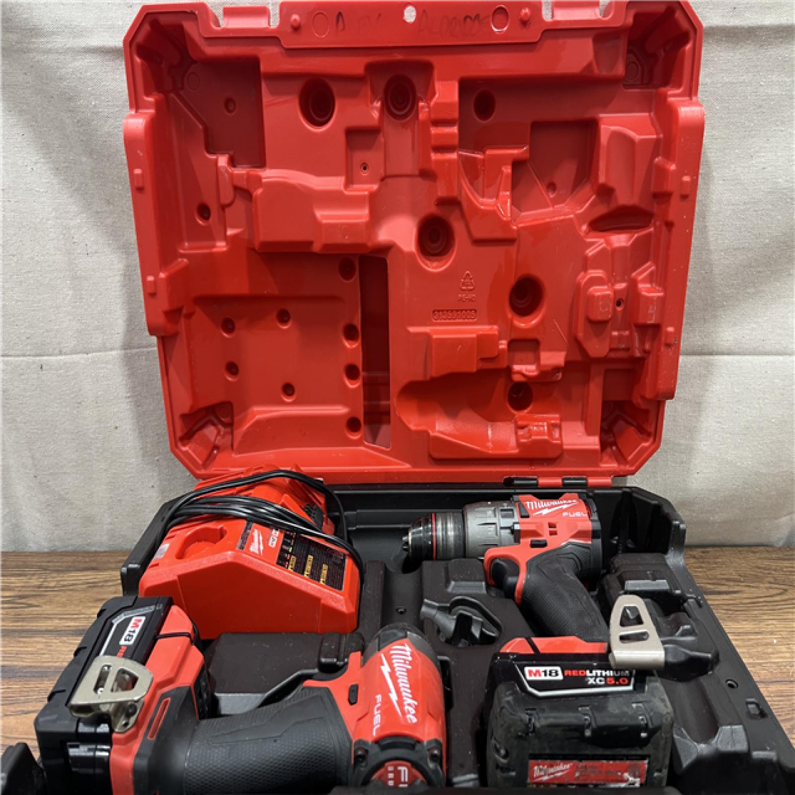 AS-IS MILWAUKEE M18 FUEL 18V Lithium-Ion Brushless Cordless Hammer Drill and Impact Driver Combo Kit (2-Tool) with 2 Batteries