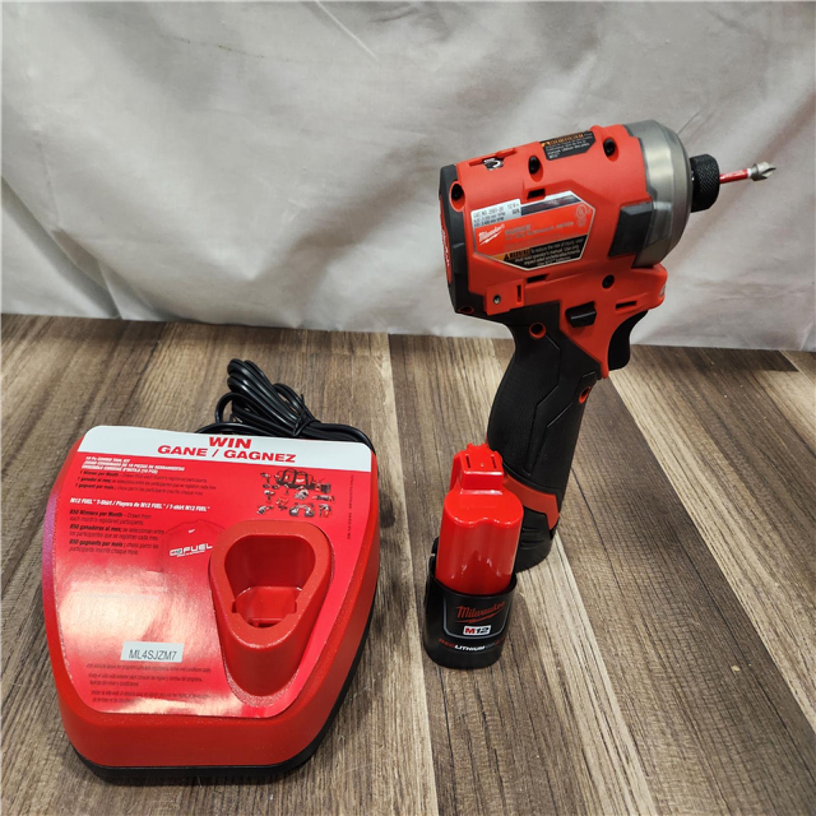 AS-IS- Milwaukee M12 FUEL SURGE 12V Lithium-Ion Brushless Cordless 1/4 in. Hex Impact Driver Compact Kit W/Two 2.0Ah Batteries  Bag