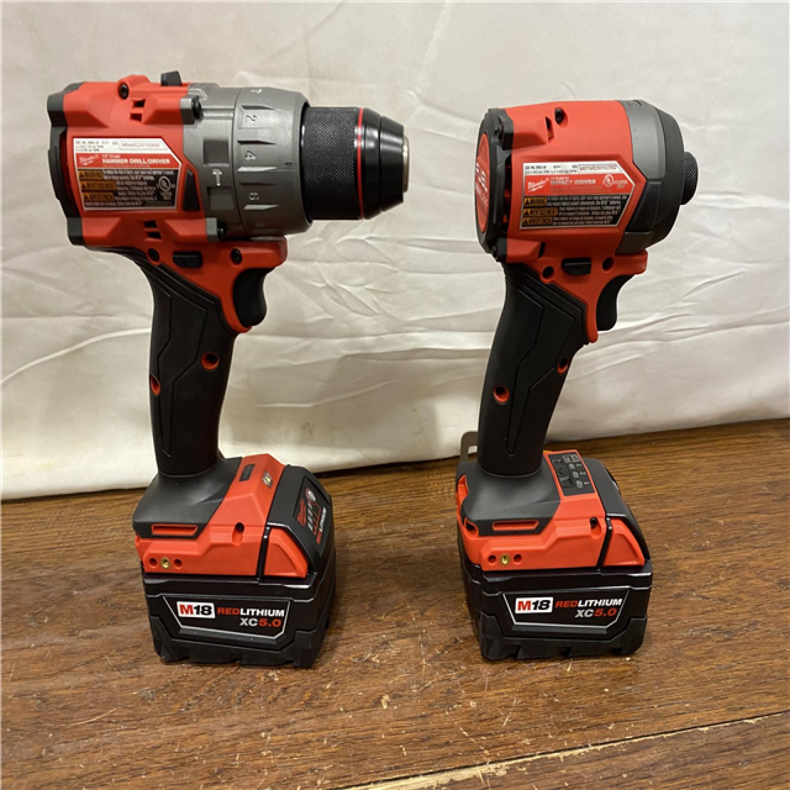 AS-IS MILWAUKEE M18 FUEL 18V Lithium-Ion Brushless Cordless Hammer Drill and Impact Driver Combo Kit (2-Tool) with 2 Batteries