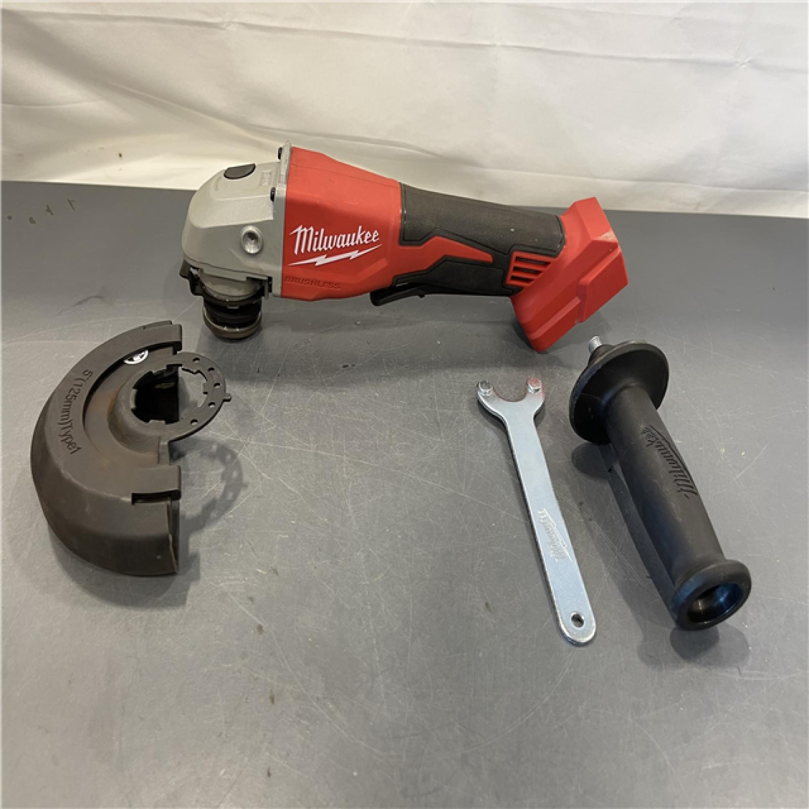 AS-IS - Milwaukee 18V Cordless 4.5 /5  Grinder W/ Paddle Switch (Tool Only)