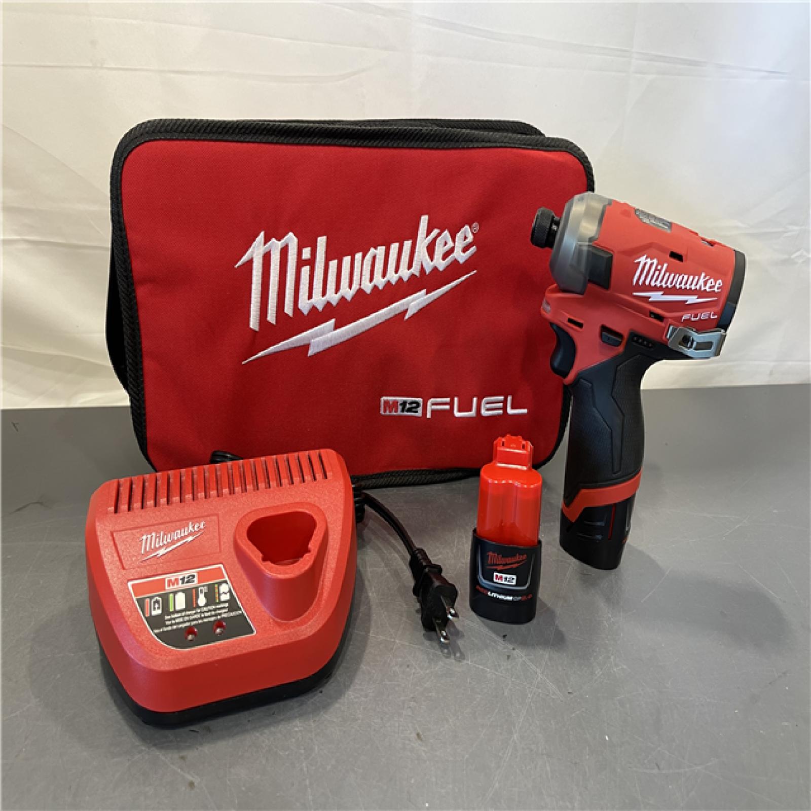 AS-IS - Milwaukee M12 FUEL SURGE 12V Lithium-Ion Brushless Cordless 1/4 in. Hex Impact Driver Compact Kit