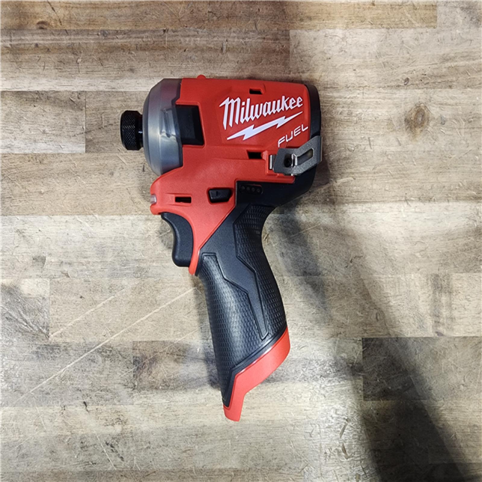 HOUSTON LOCATION - AS-IS (APPEARS LIKE NEW) Milwaukee M12 FUEL SURGE 12V Lithium-Ion Brushless Cordless 1/4 in. Hex Impact Driver Compact Kit W/Two 2.0Ah Batteries  Bag