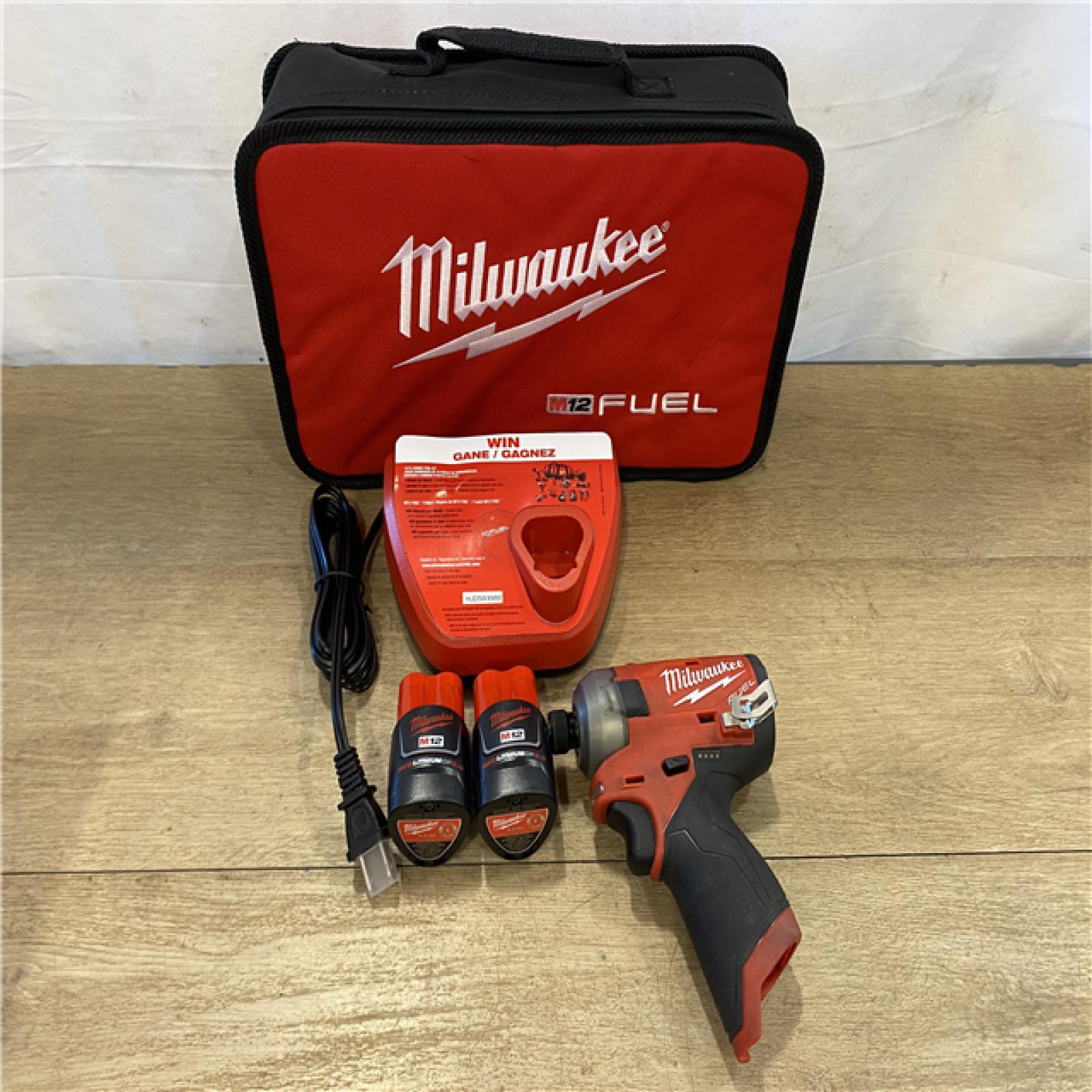AS-IS Milwaukee FUEL SURGE 12V Lithium-Ion Brushless Cordless 1/4 in. Hex Impact Driver Compact Kit