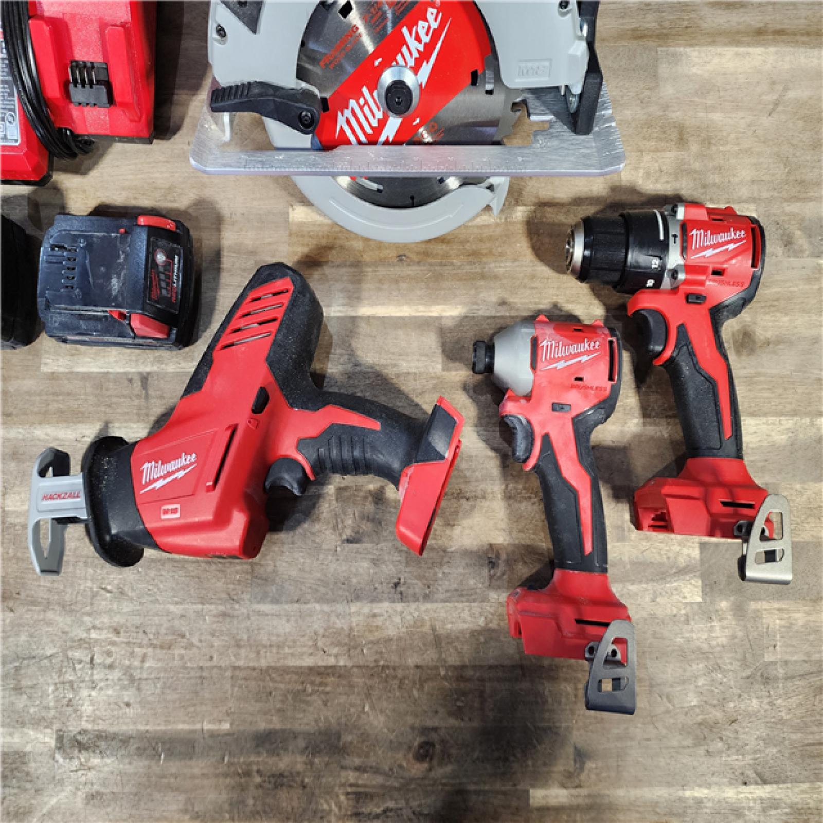 HOUSTON LOCATION - AS-IS Milwaukee M18 18-Volt Lithium-Ion Brushless Cordless Combo Kit (4-Tool) with 2-Batteries, 1-Charger and Tool Bag