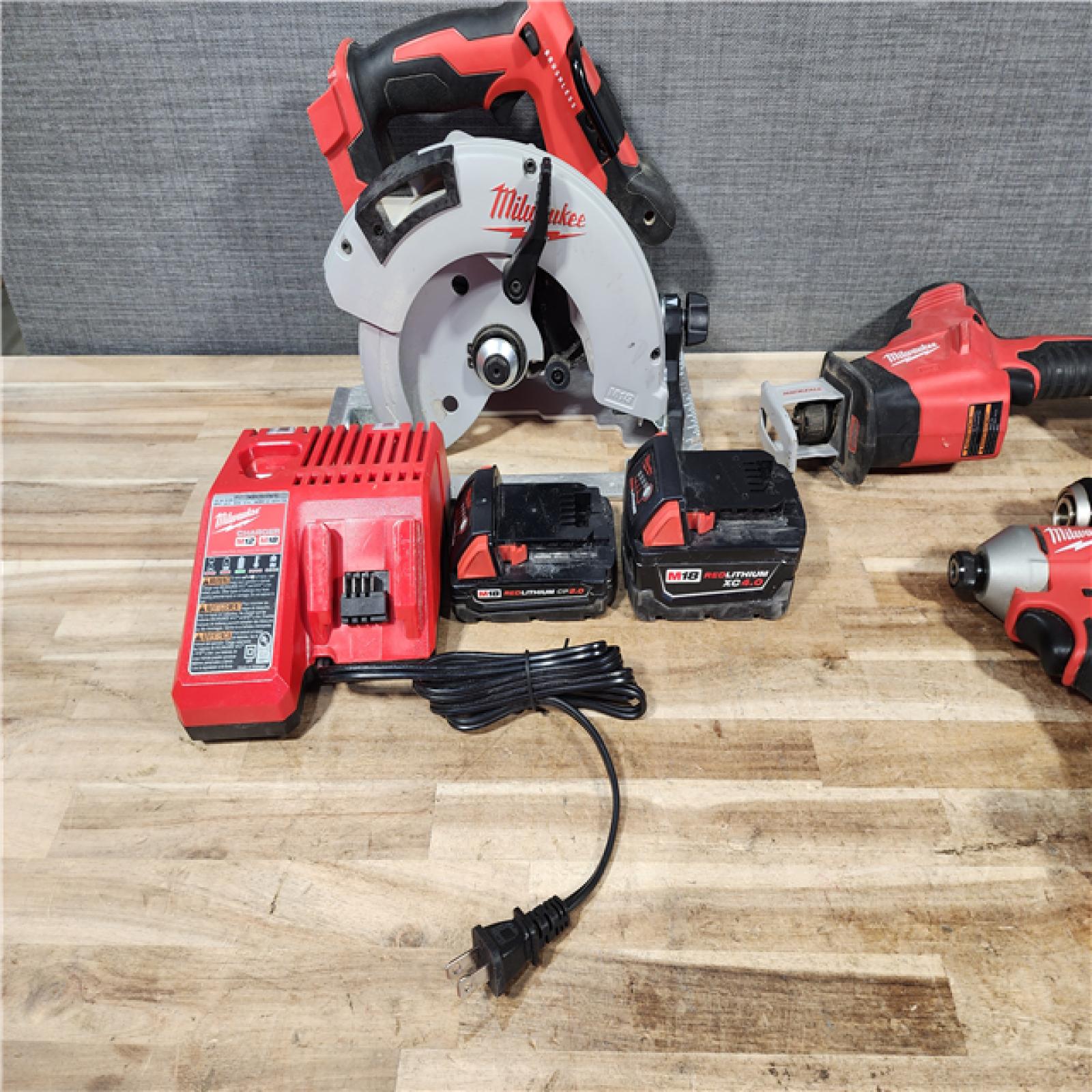 HOUSTON LOCATION - AS - IS Milwaukee 4 Tool Combo Kit W/ (2) Battery & Charger